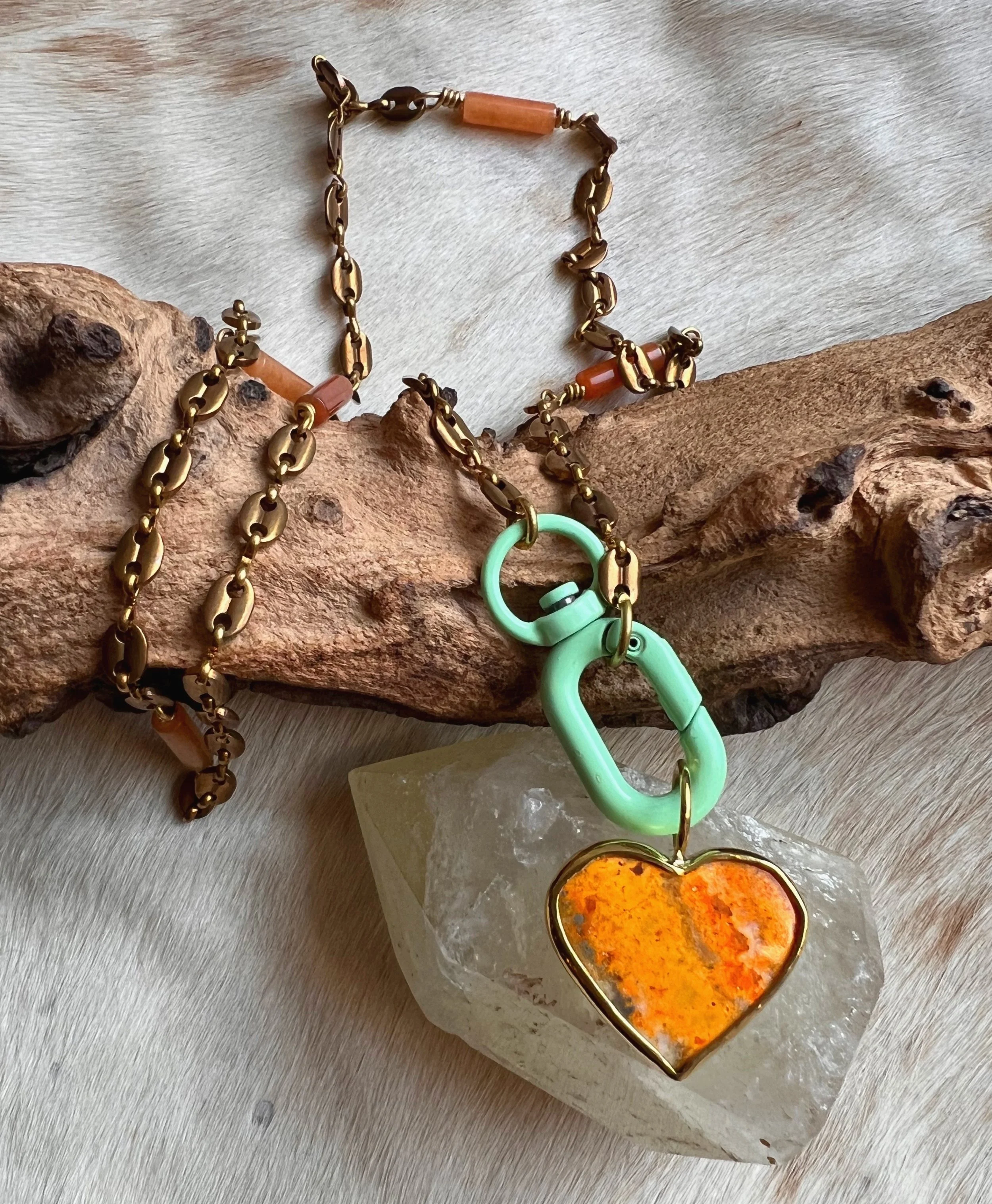 Heart shaped jasper stone set on a long vintage brass chain.