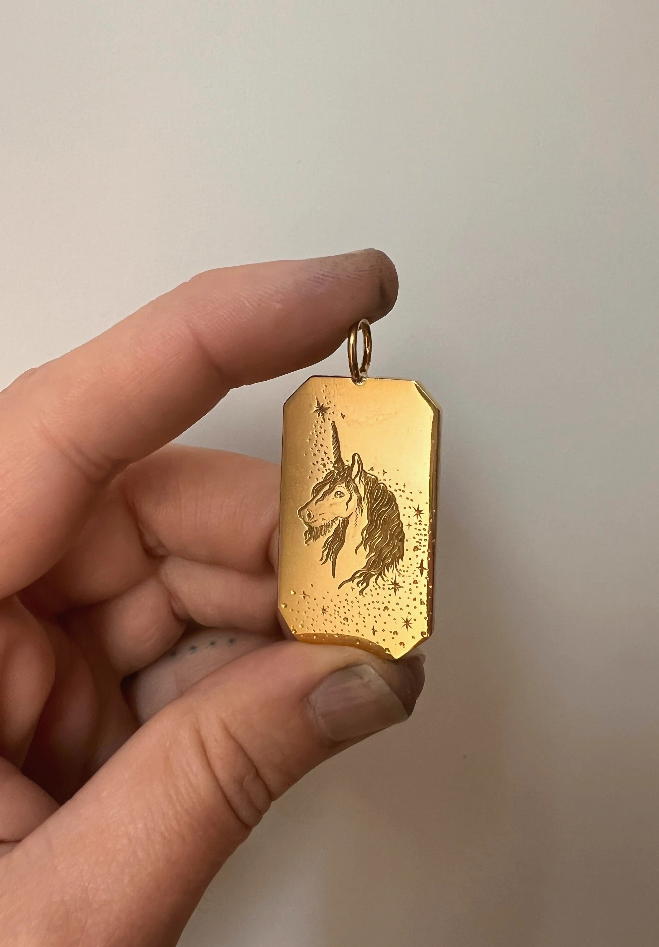 Hand engraved brass Unicorn Pendant
