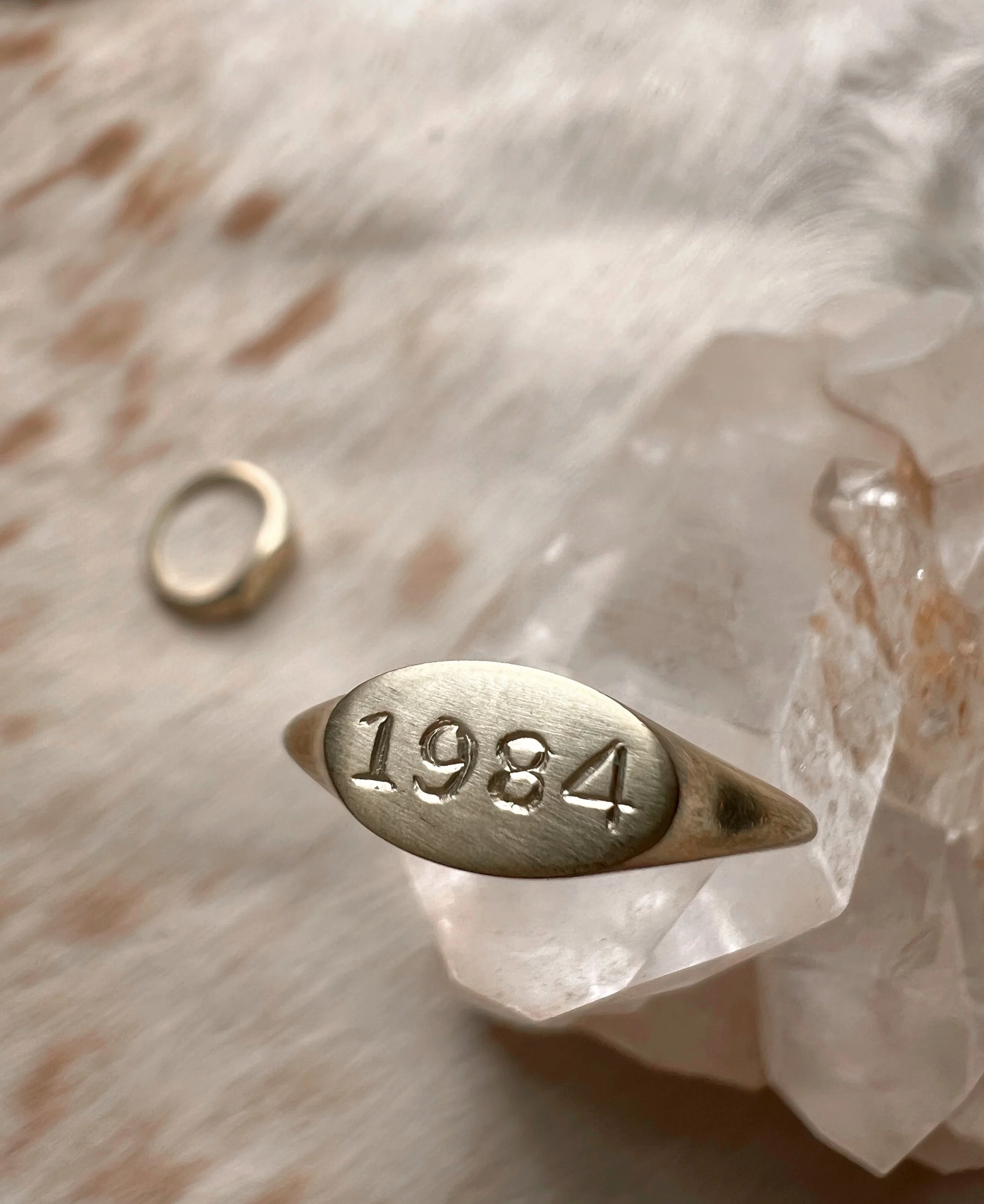 Personalized brass signet ring with a custom engraved birth year