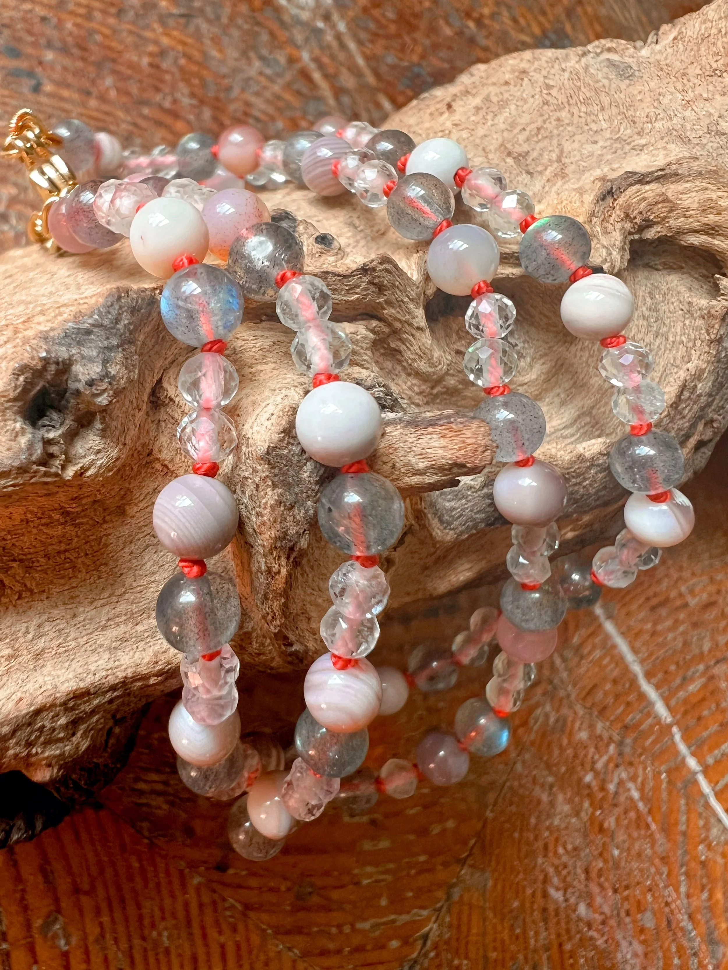 Hand-knotted necklace on pure silk featuring colorful gemstone beads