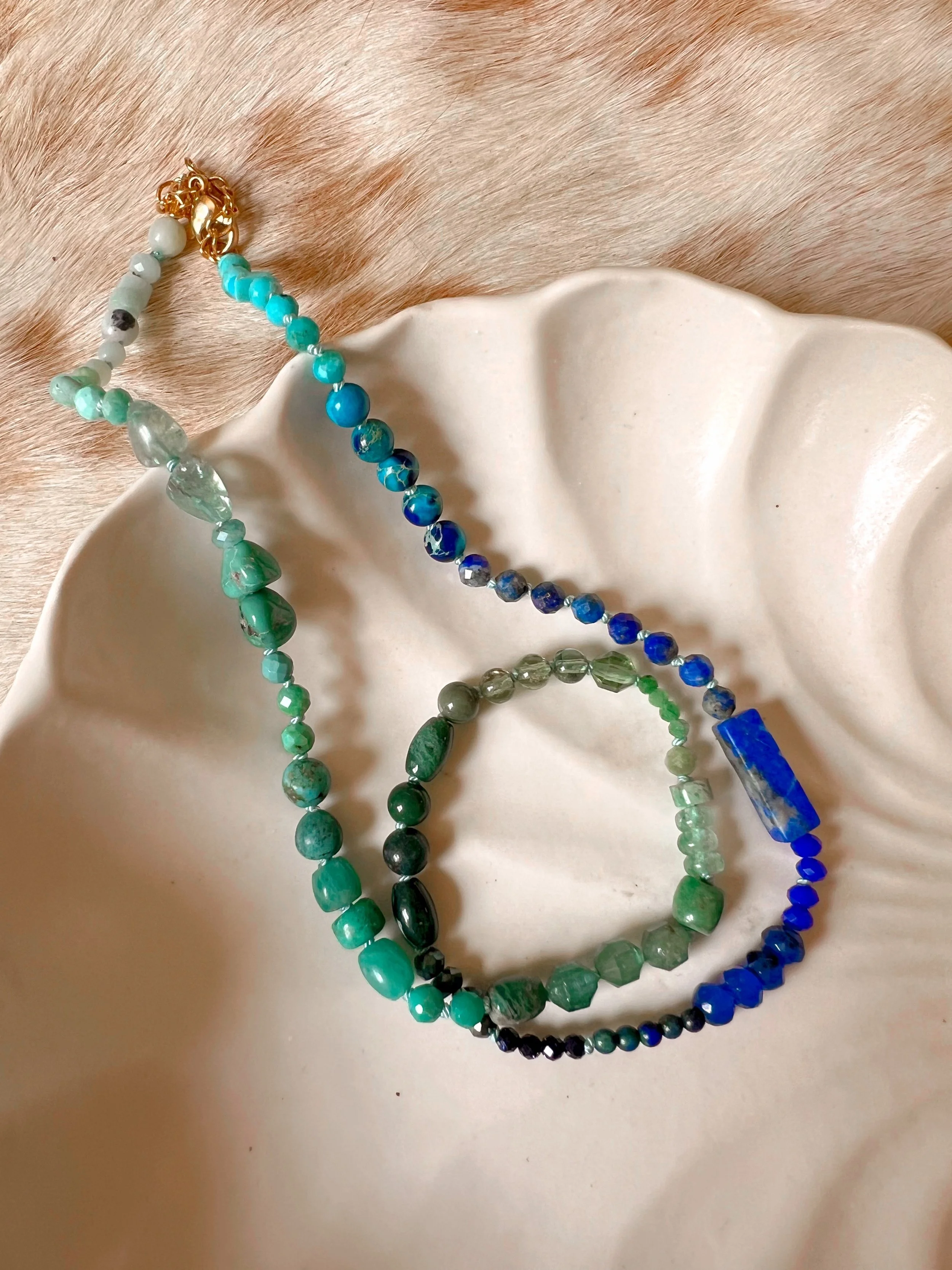 Hand-knotted necklace on pure silk featuring colorful gemstone beads