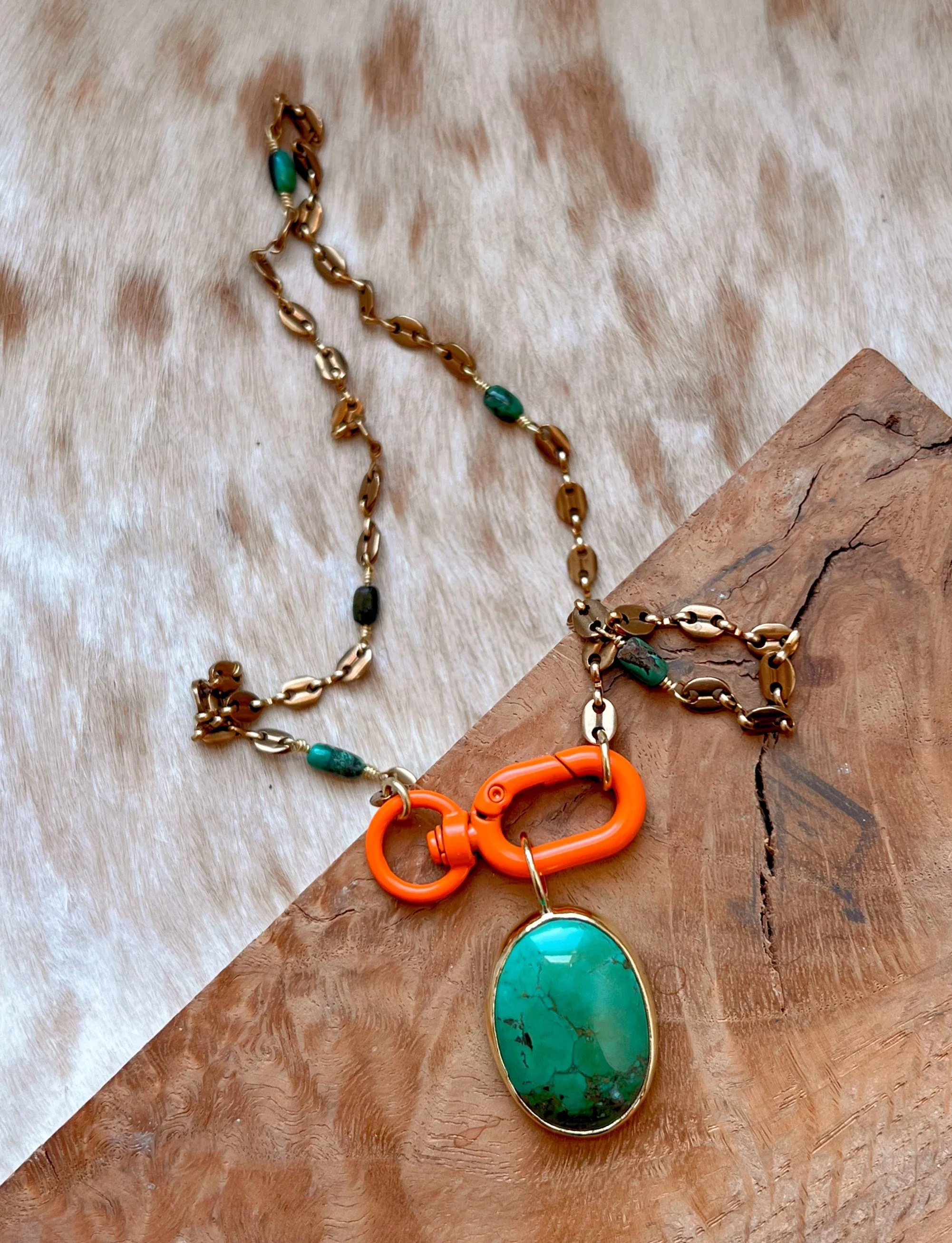 Large turquoise necklace on a bright orange toggle clasp