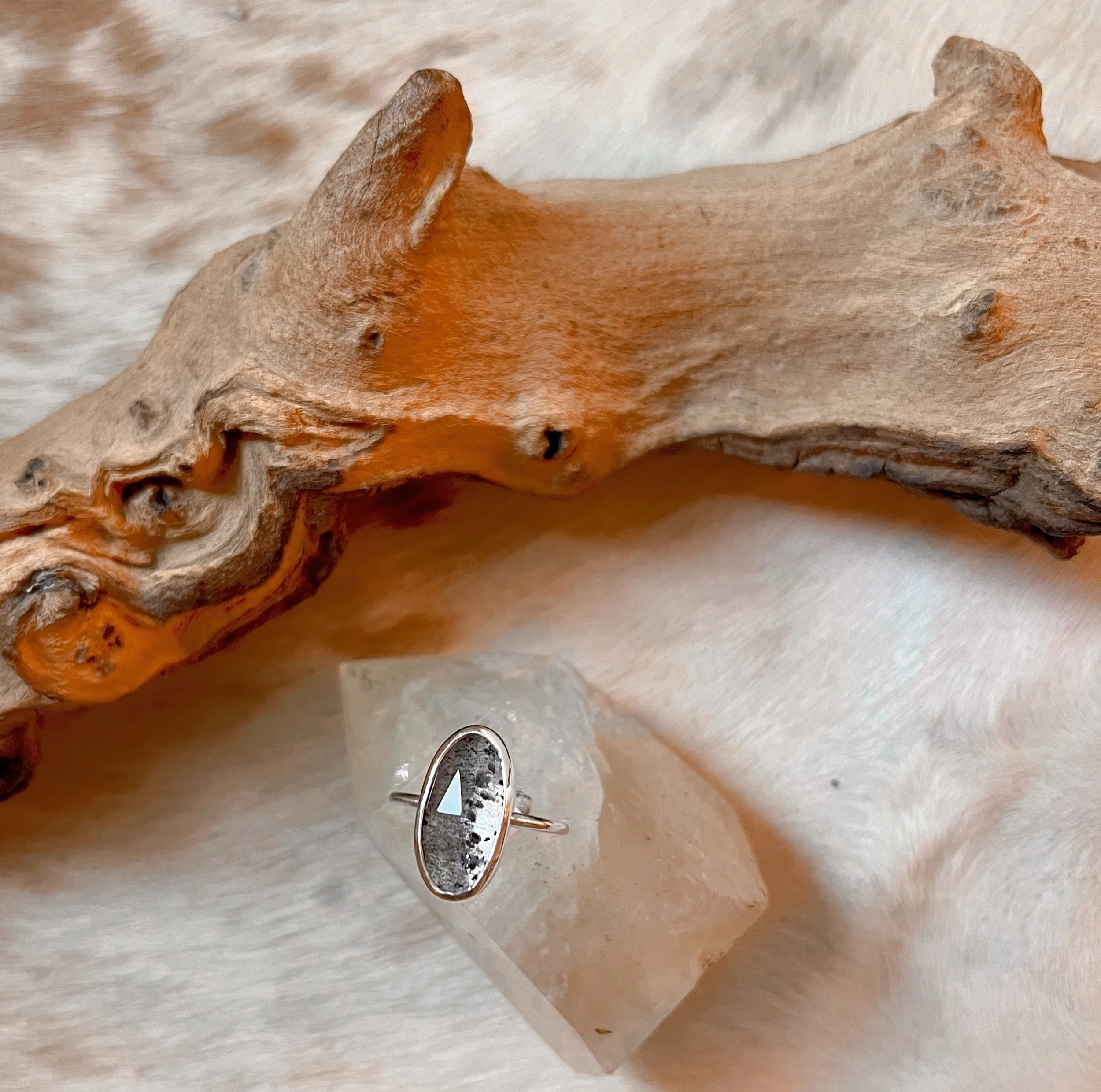 Sterling silver ring with a bezel-set faceted black tourmalated quartz.