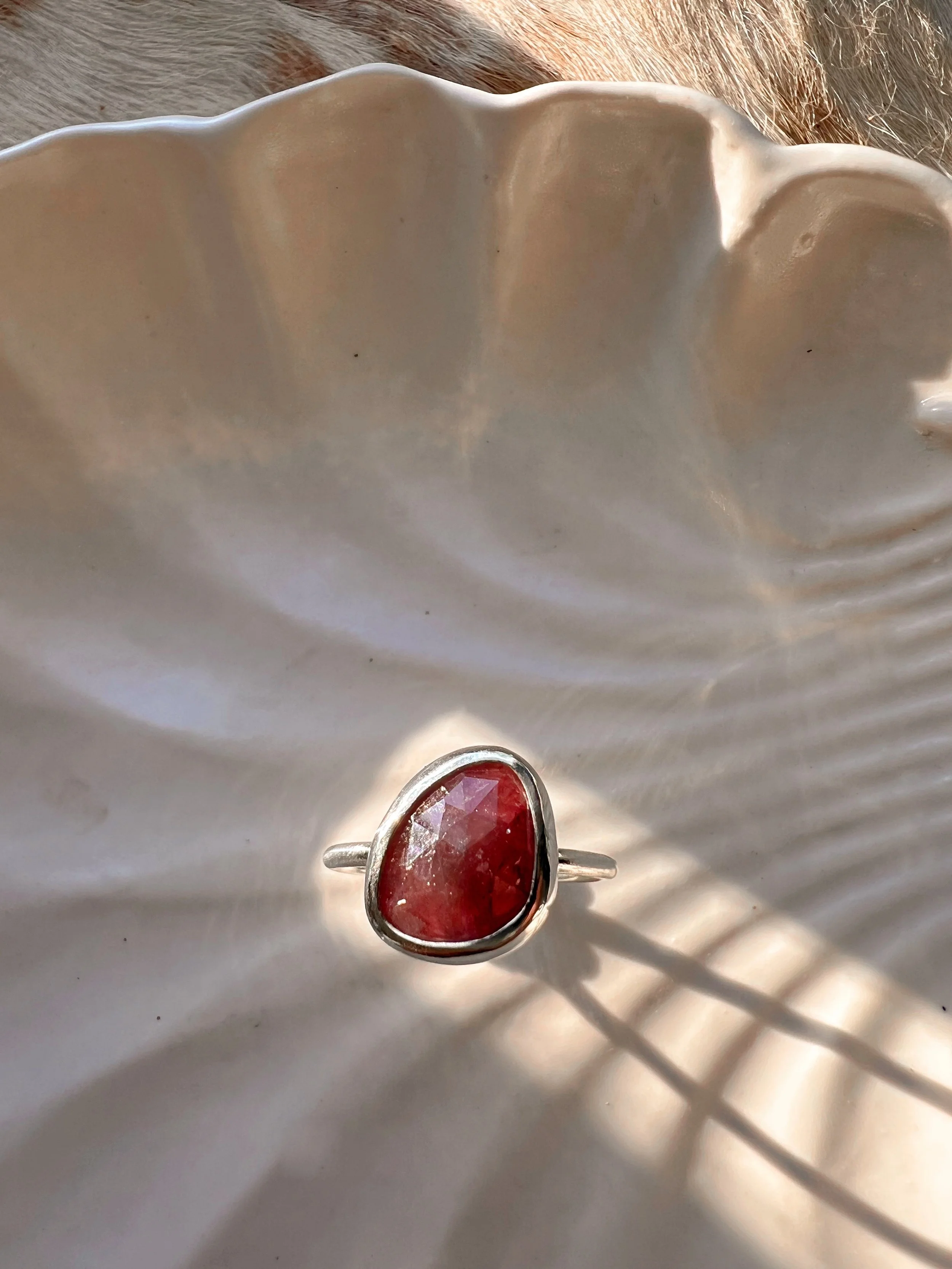 Sterling silver ring with a bezel-set , rose-cut pink Sapphire