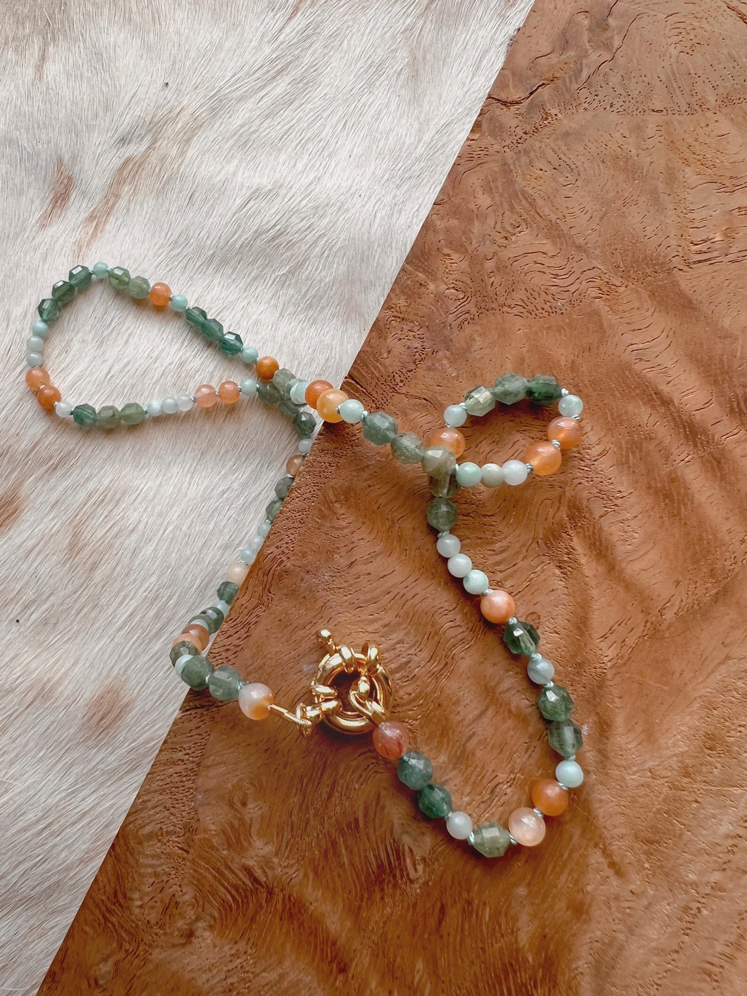 Hand-knotted necklace on pure silk featuring colorful gemstone beads