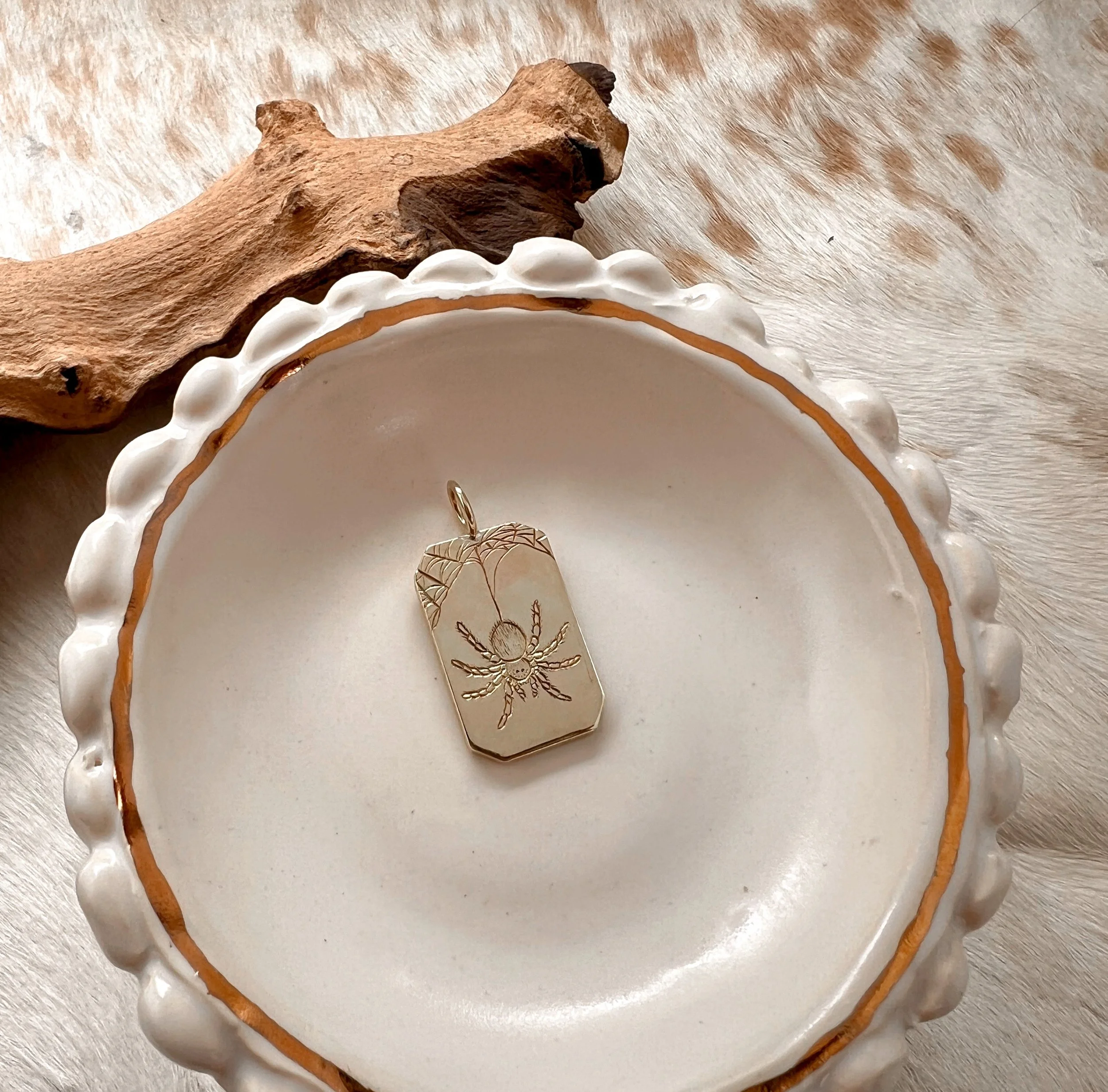 engraved brass spider pendant