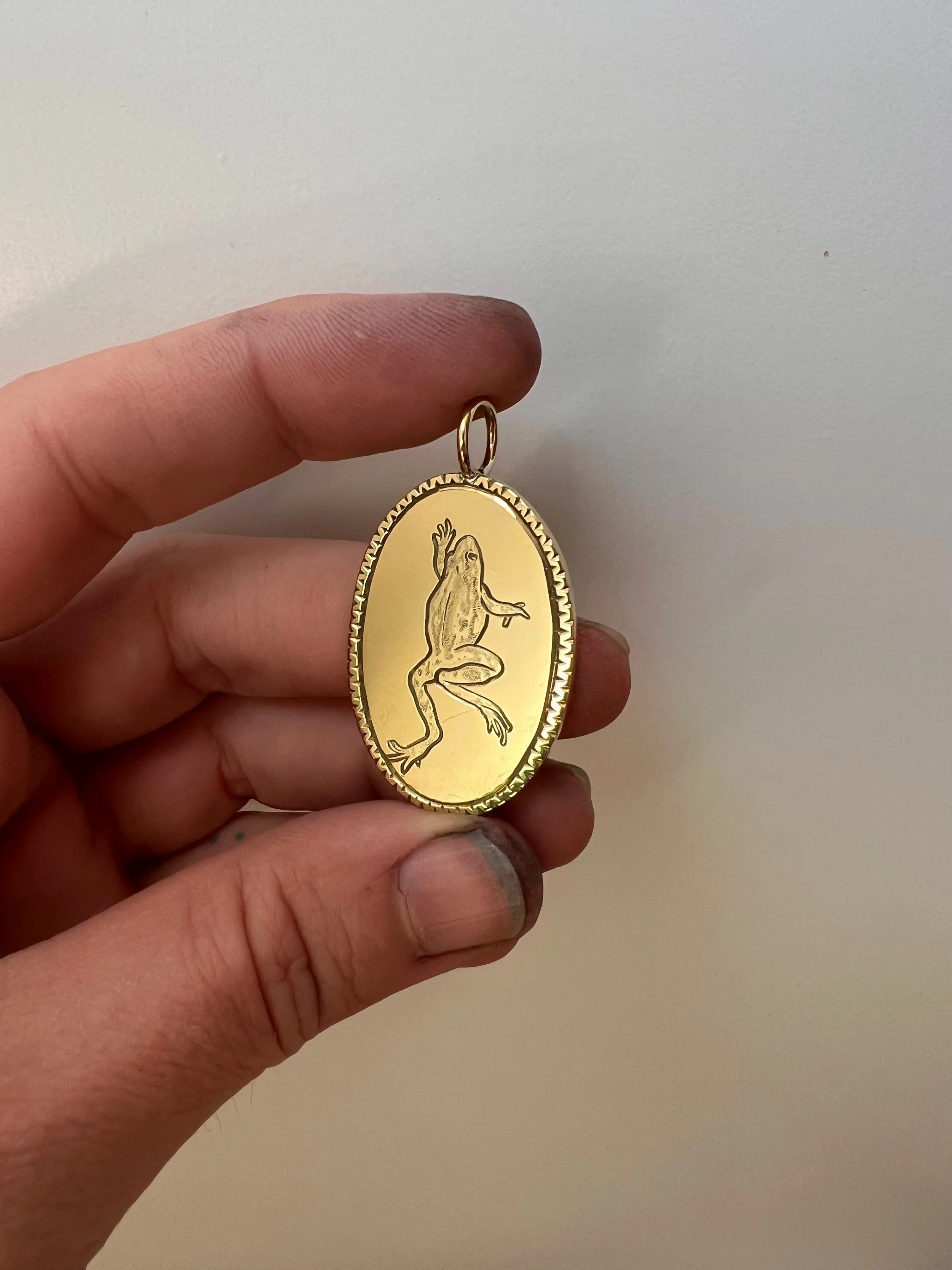 Engraved frog pendant