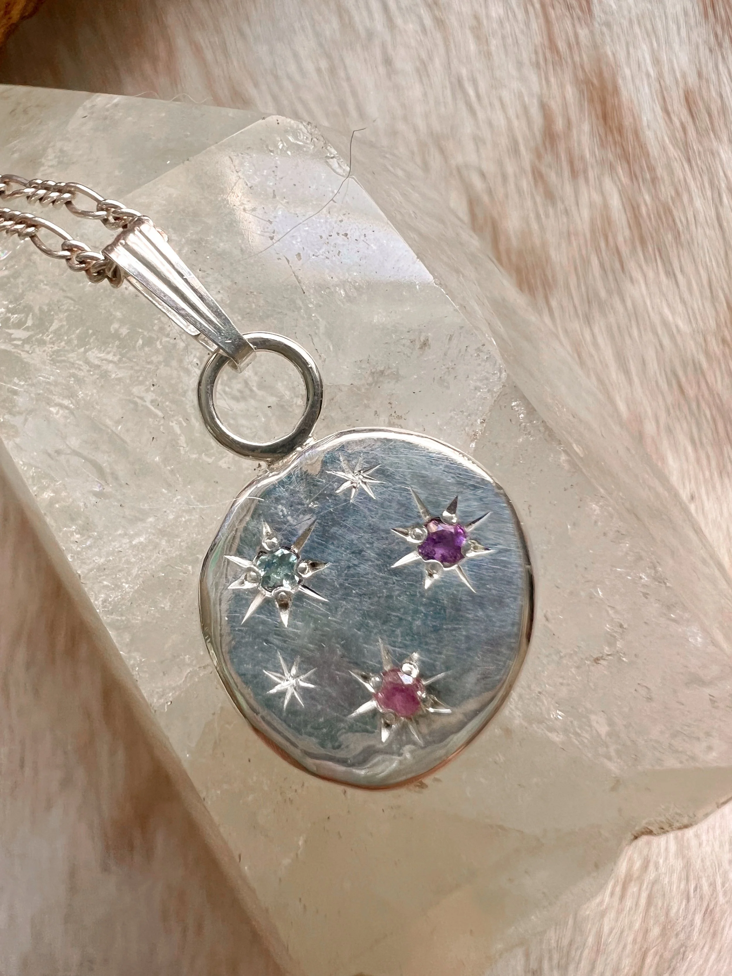 made from recycled sterling silver with a constellation of star-set gemstones