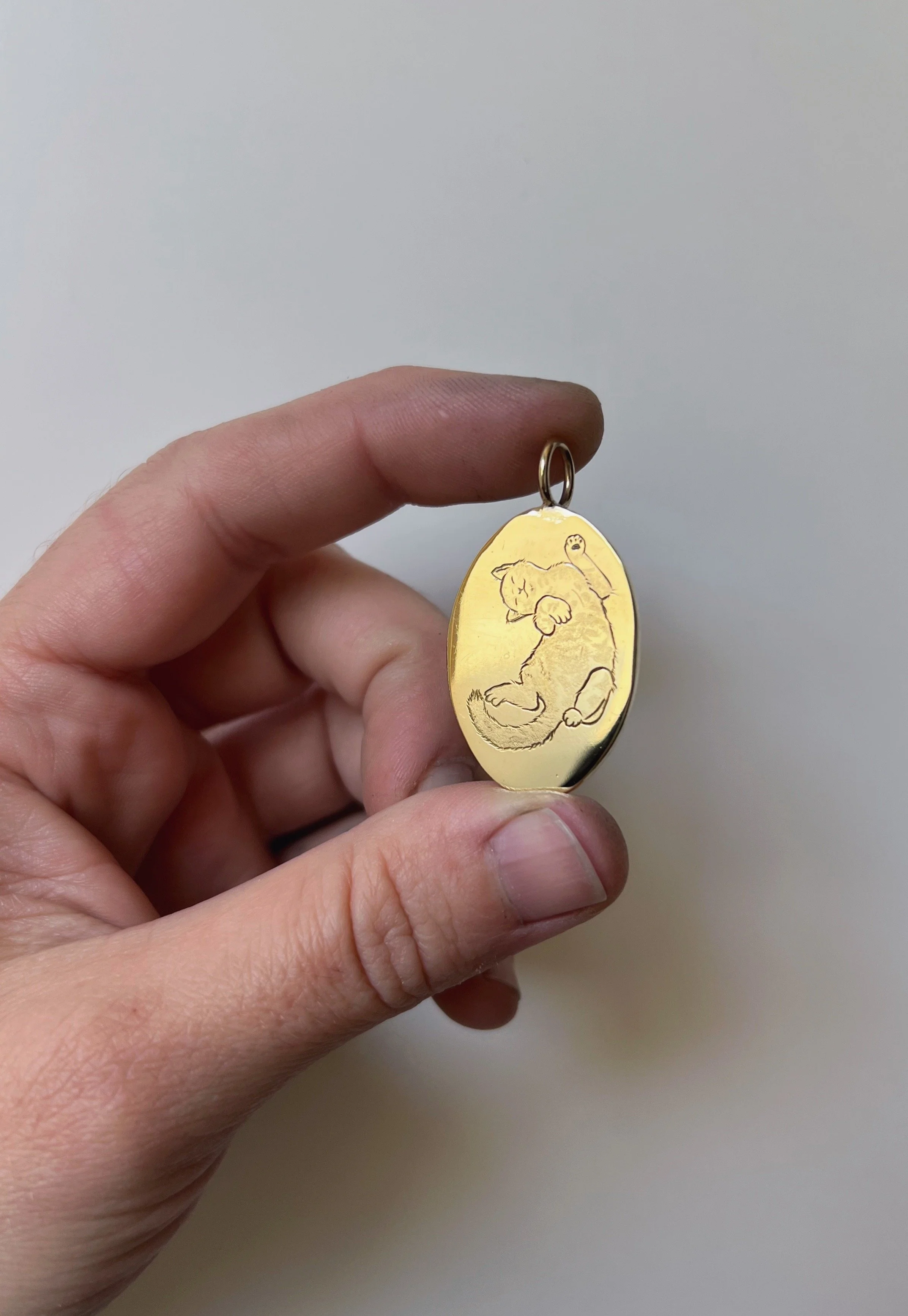 hand engraved cat pendant