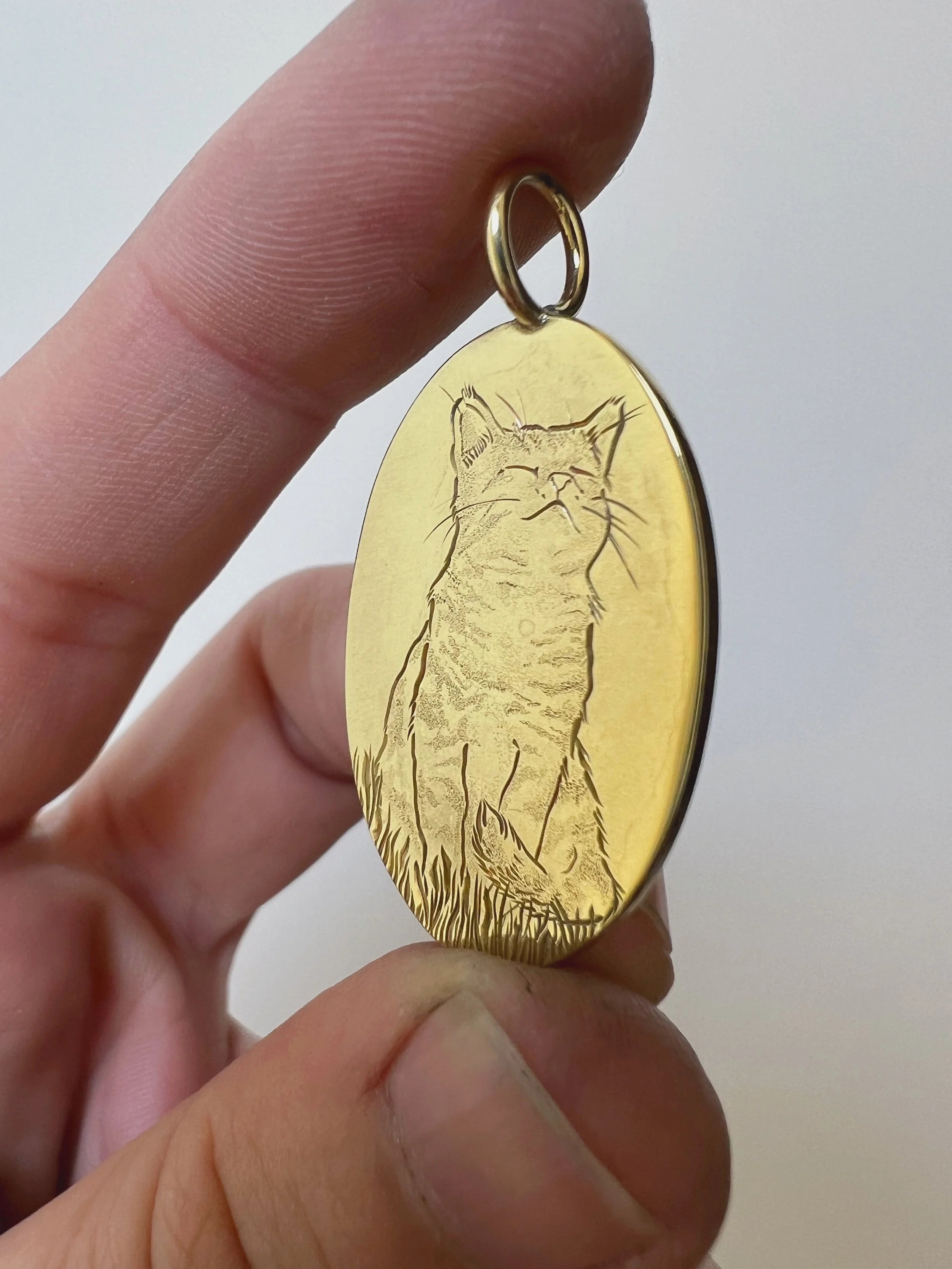 hand engraved cat pendant