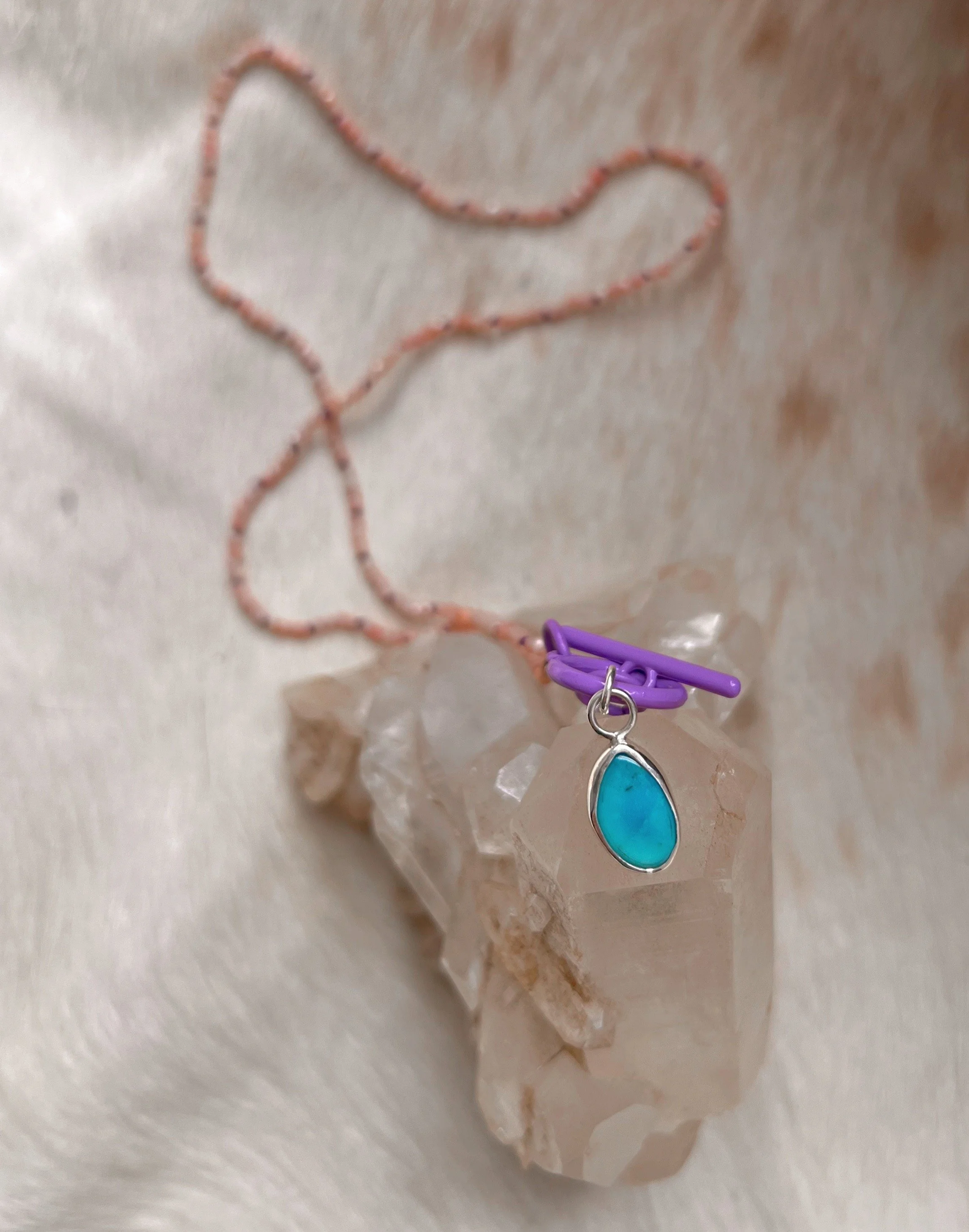 pink opal beaded necklace with a center turquoise pendant
