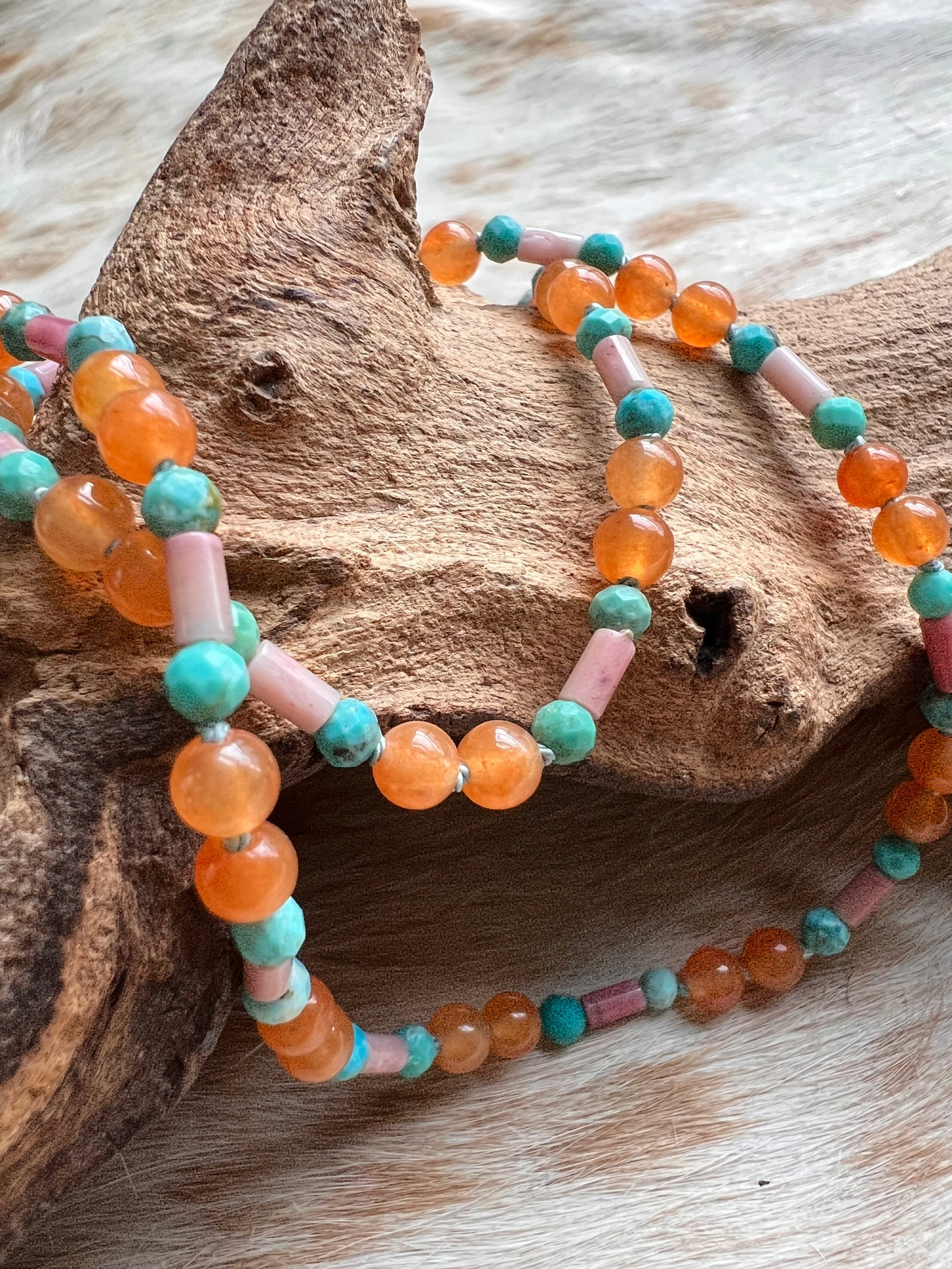 Hand-knotted necklace on pure silk featuring colorful gemstone beads