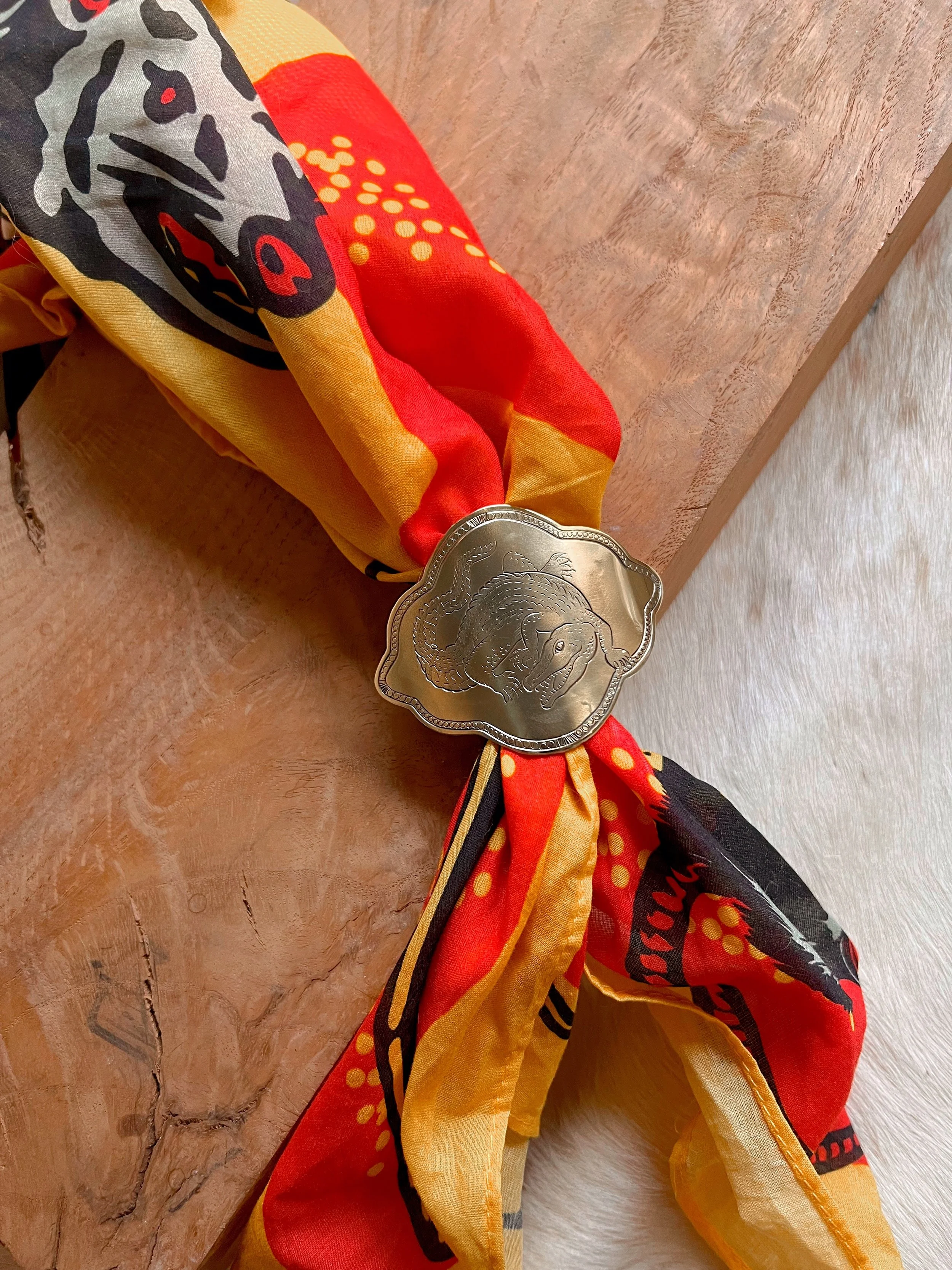 One-of-a-kind hand-engraved brass slide featuring an alligator