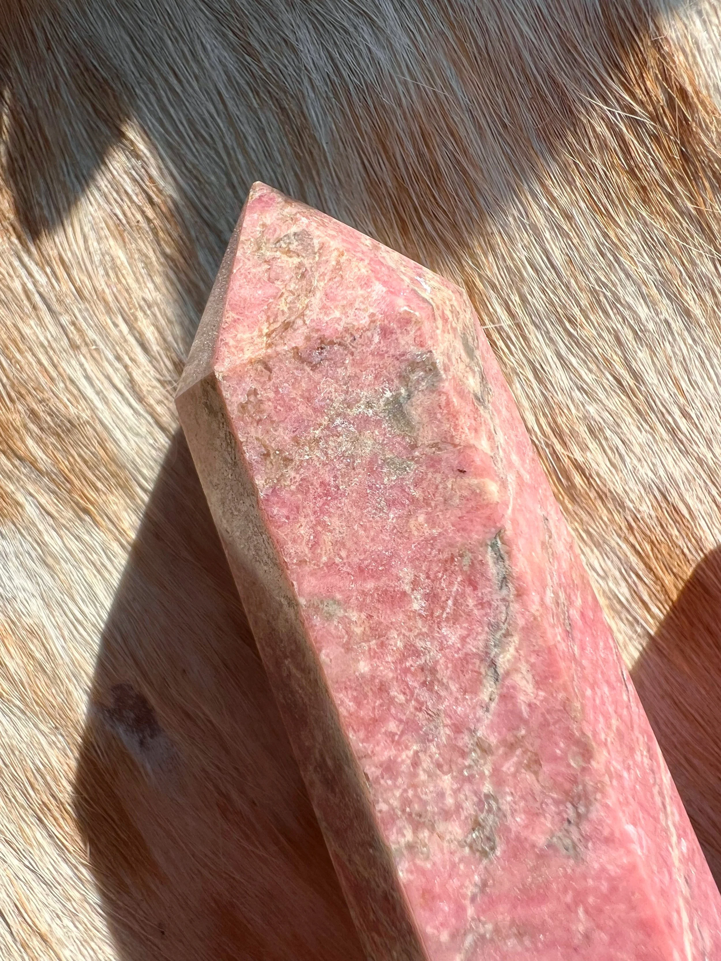 Natural gemstone tower, Rhodonite