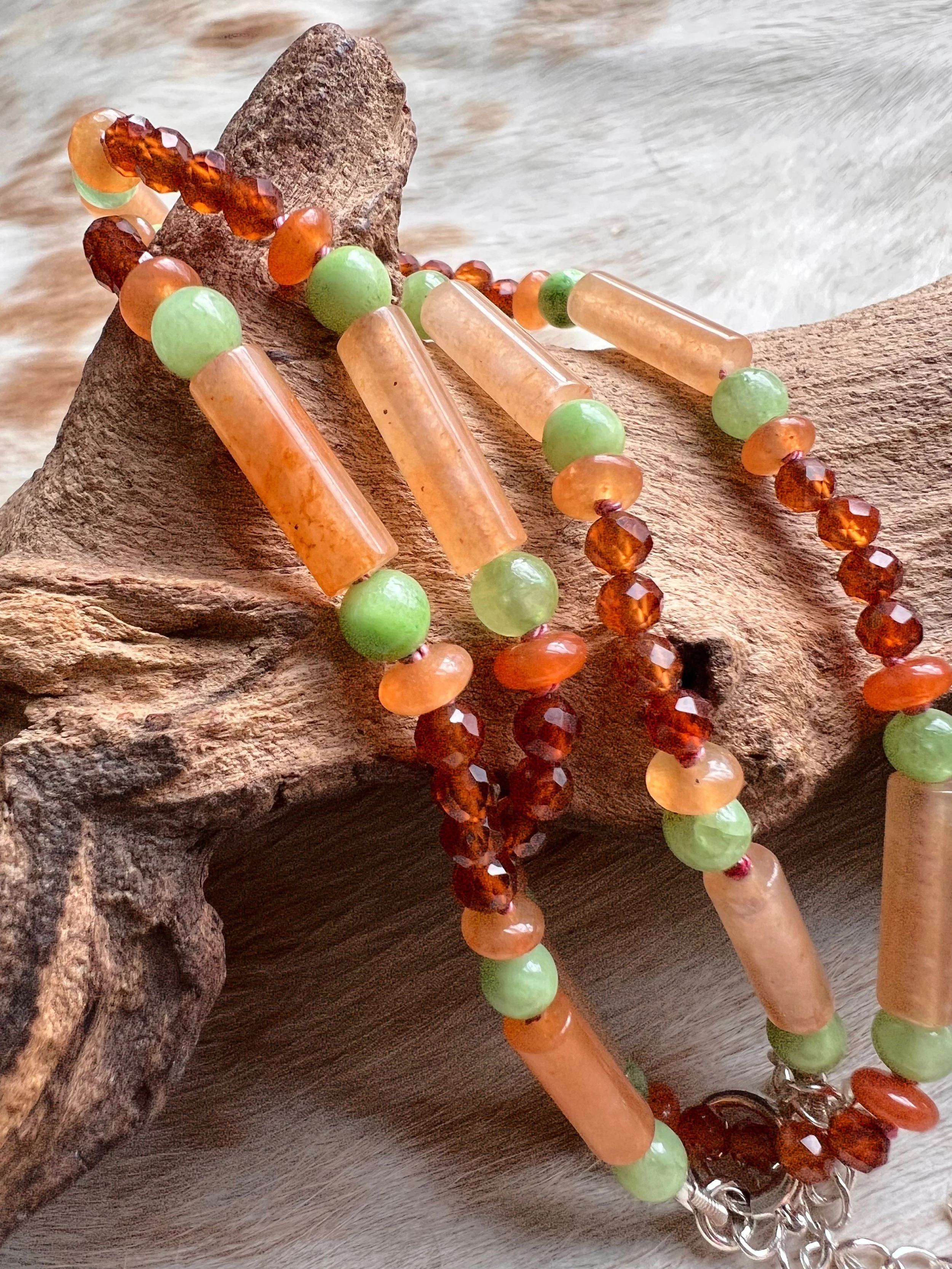 Hand-knotted necklace on pure silk featuring colorful gemstone beads