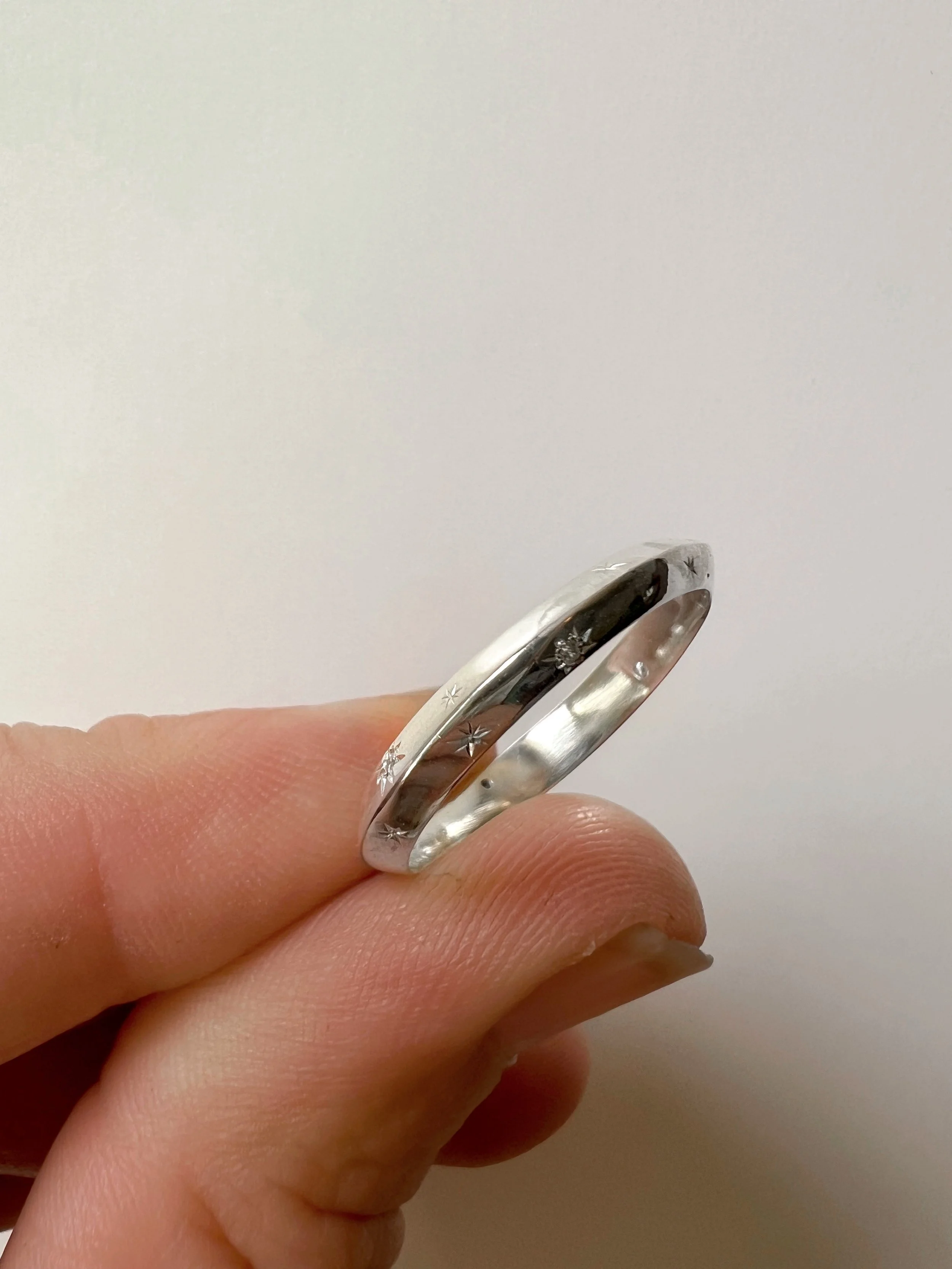 Hand engraved star ring