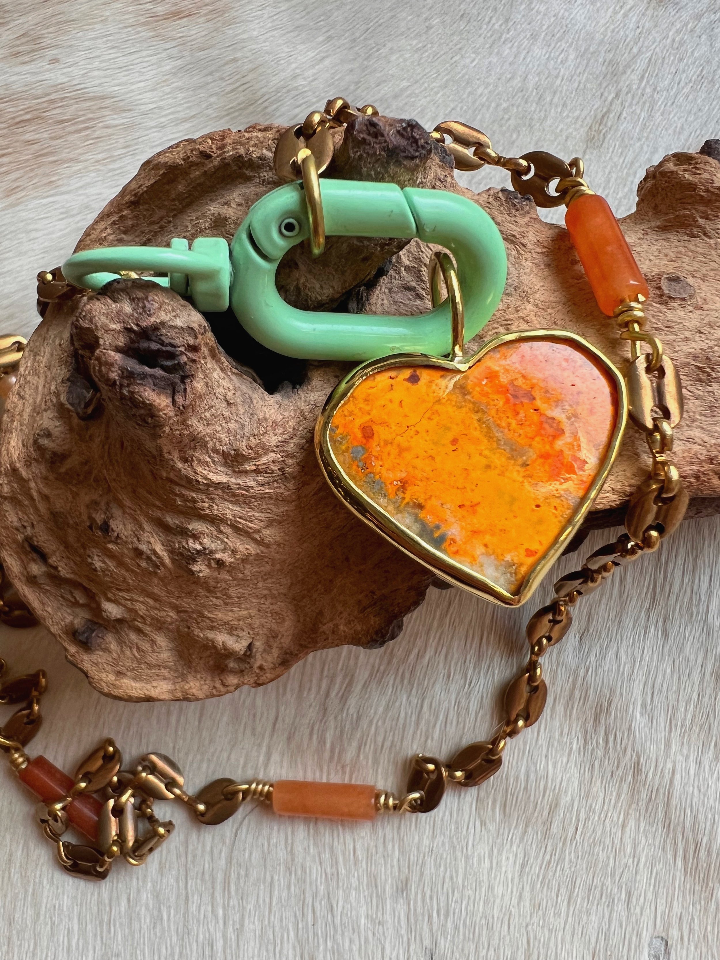 Heart shaped jasper stone set on a long vintage brass chain.