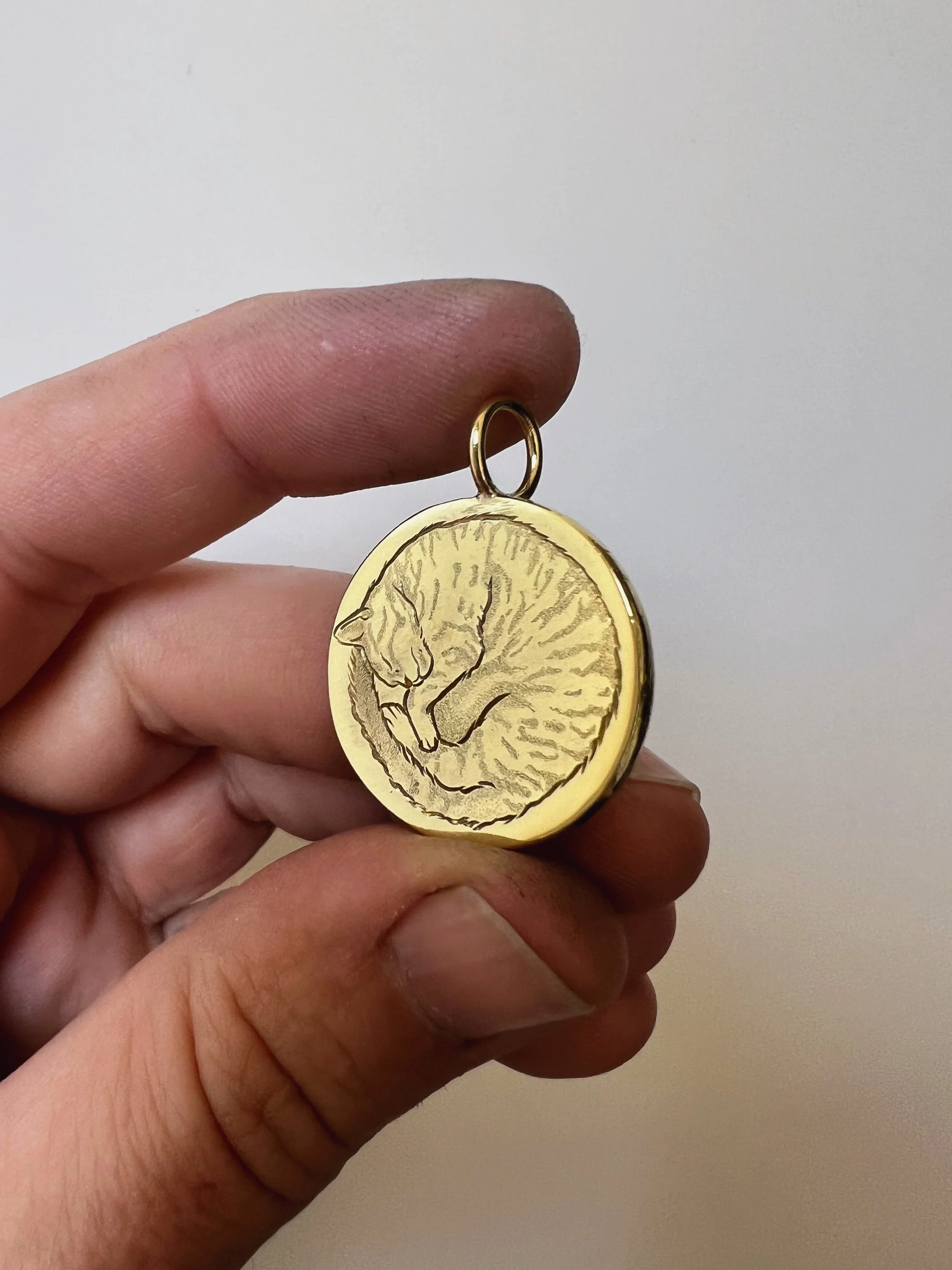 hand engraved cat pendant
