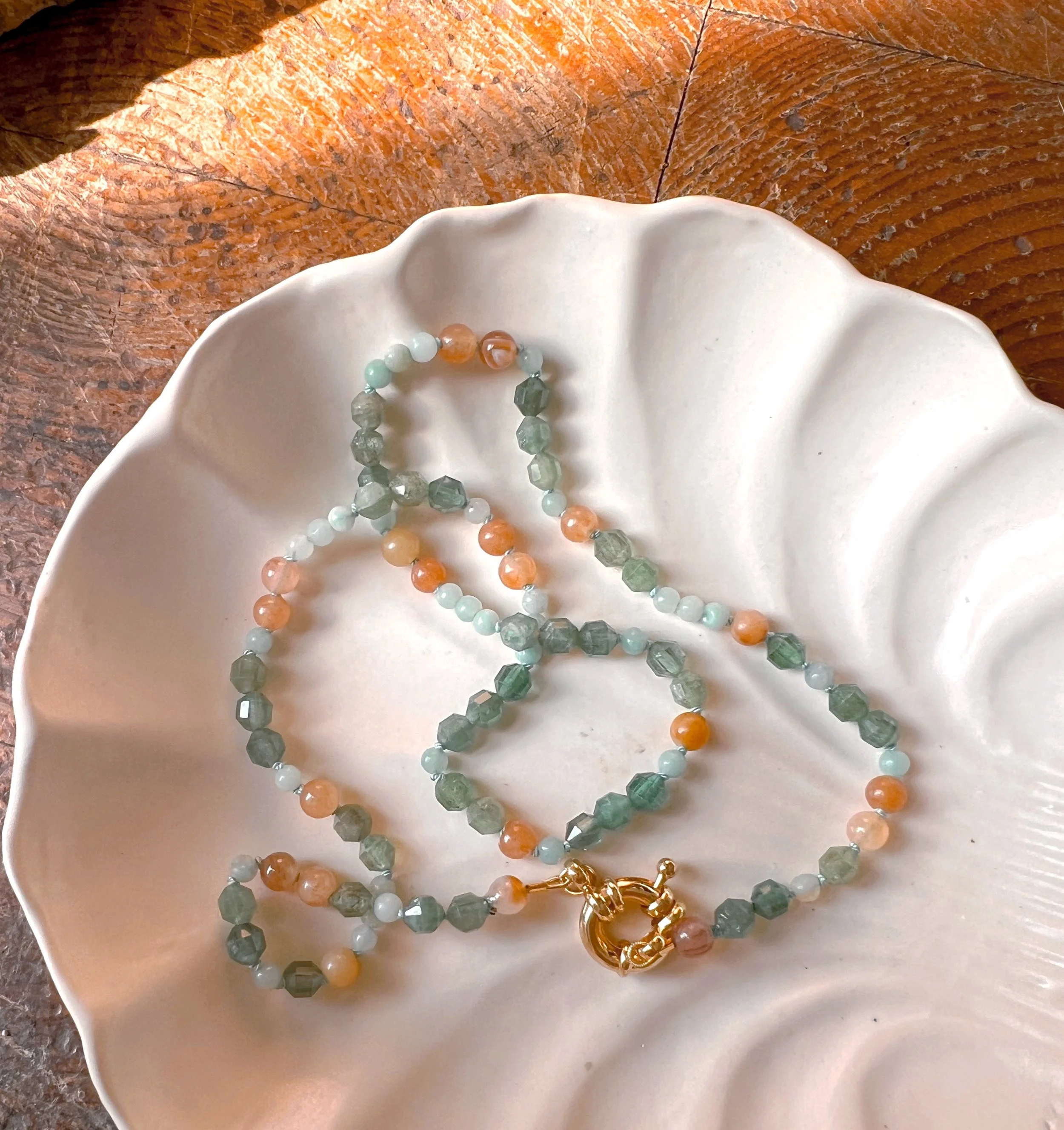 Hand-knotted necklace on pure silk featuring colorful gemstone beads