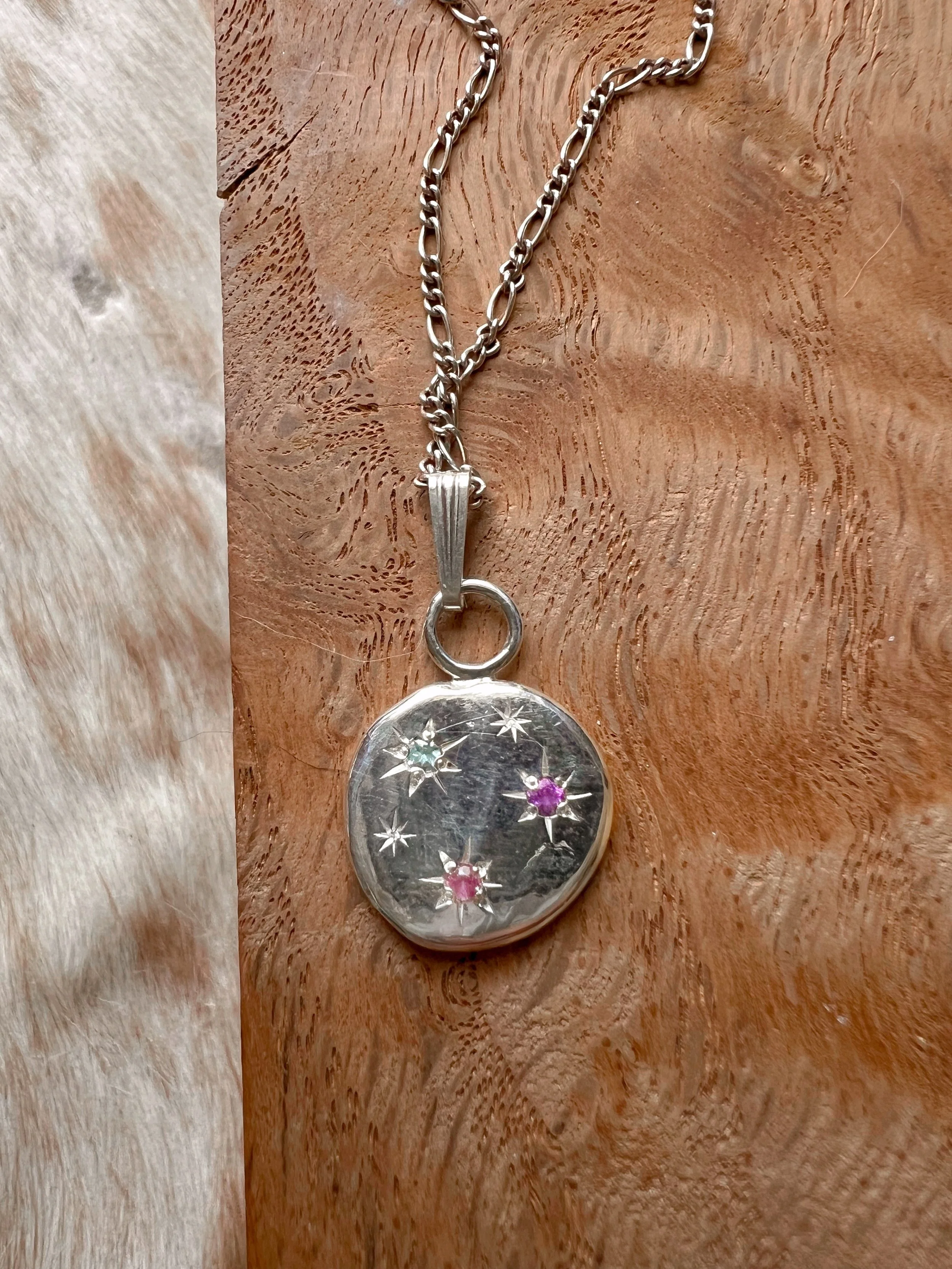 made from recycled sterling silver with a constellation of star-set gemstones