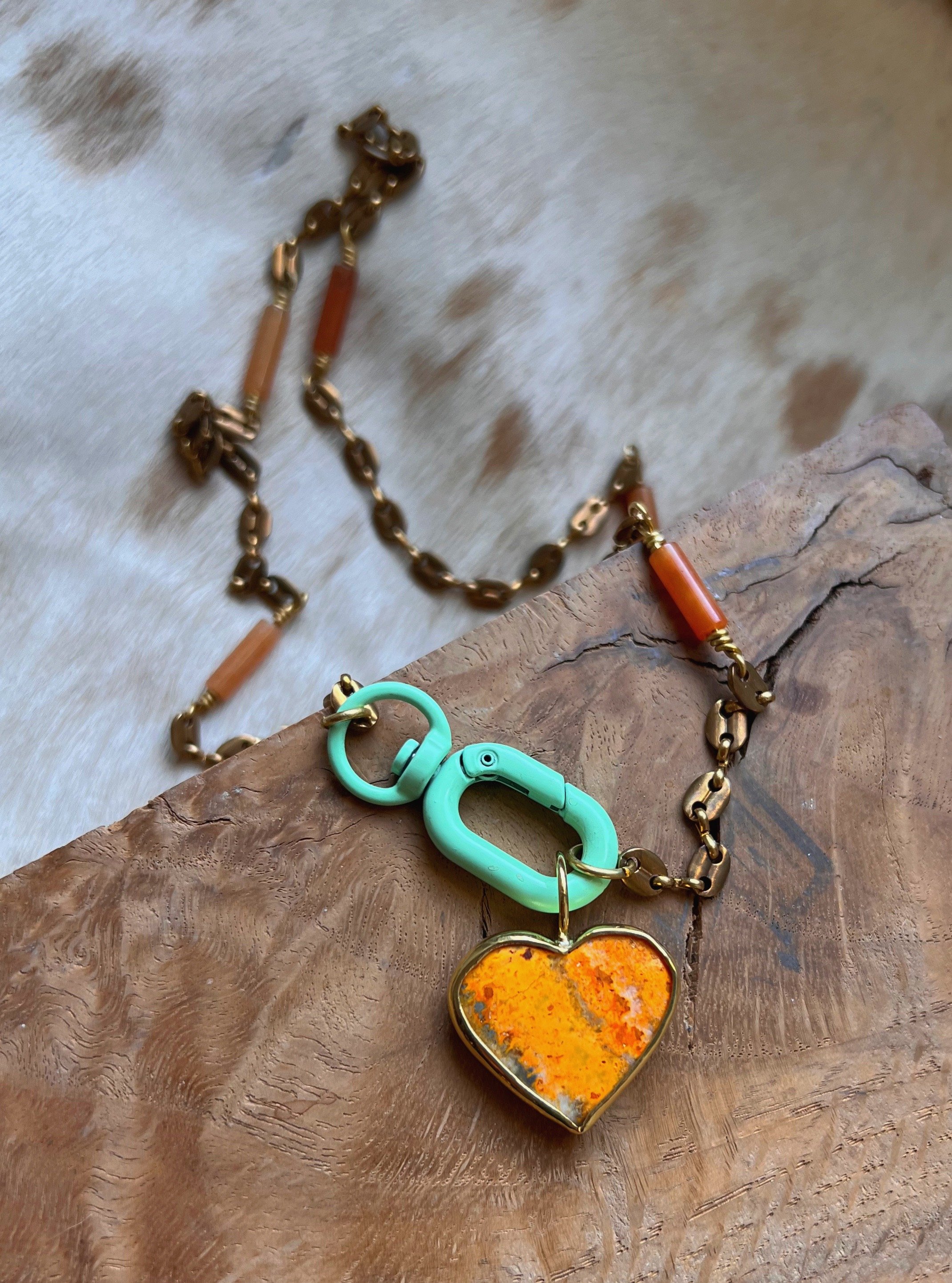 Heart shaped jasper stone set on a long vintage brass chain.