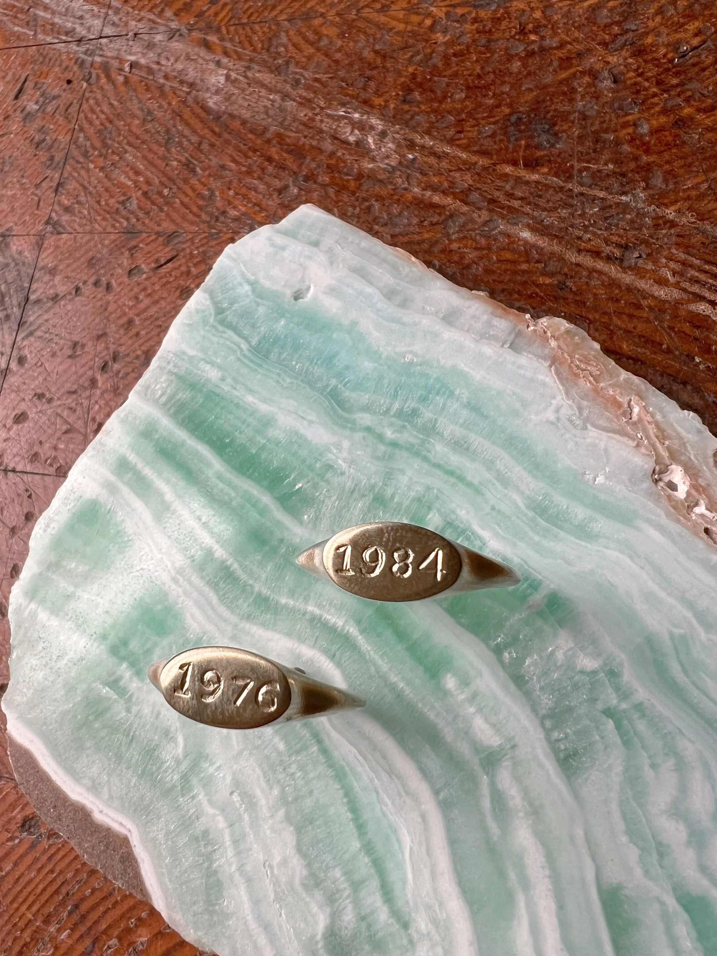 Personalized brass signet ring with a custom engraved birth year