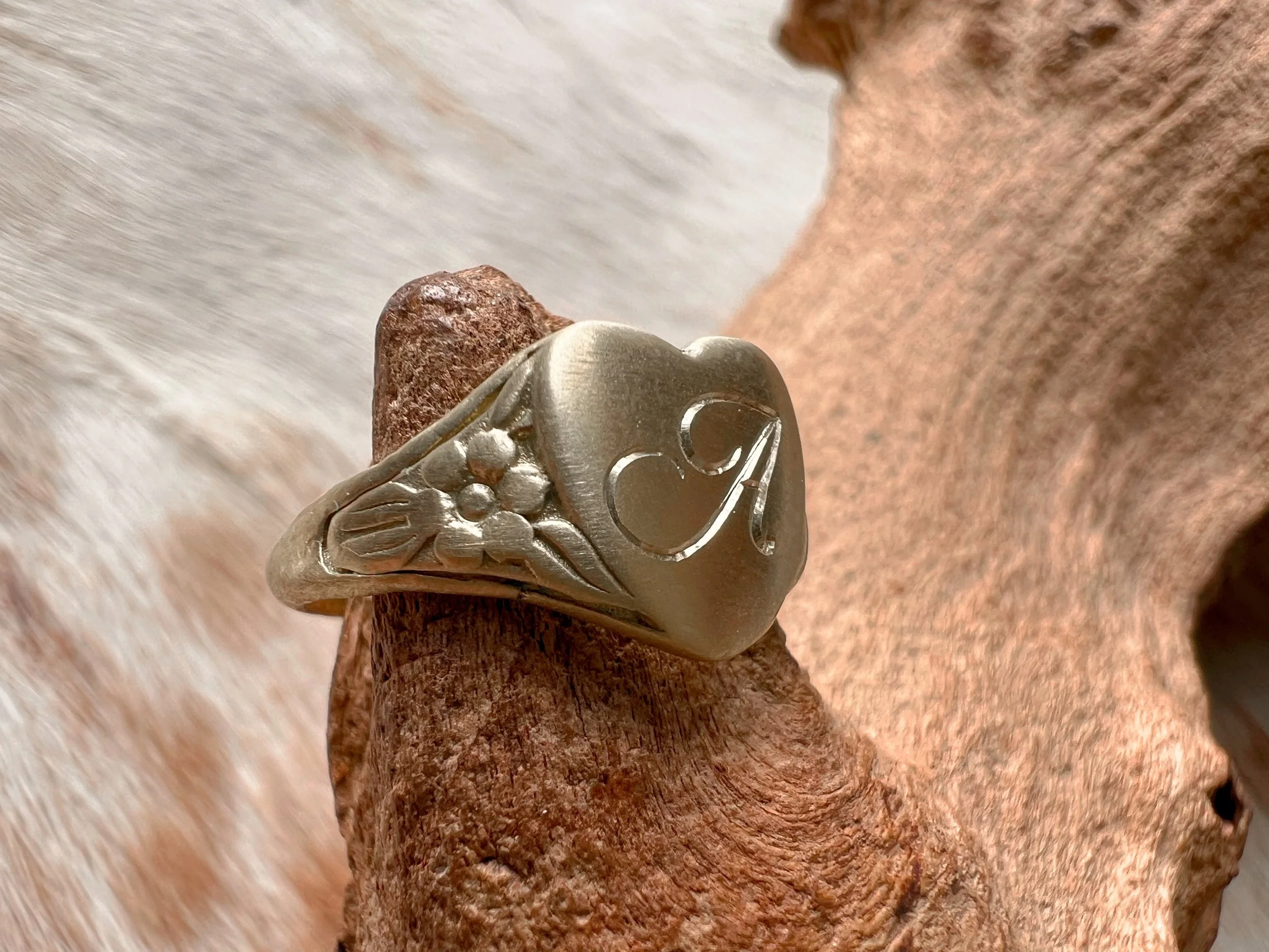 Personalized heart shaped brass signet ring with a custom script letter