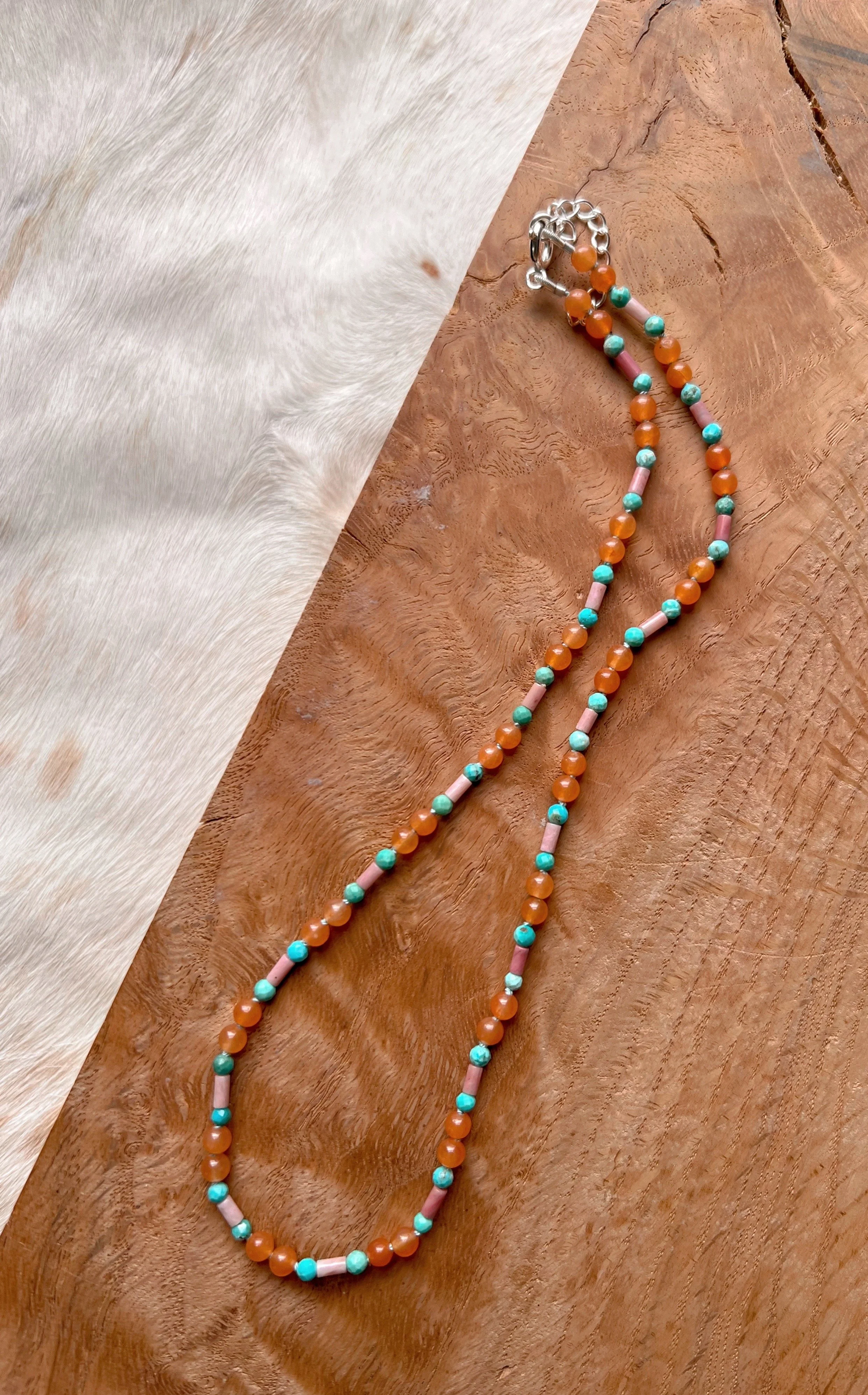 Hand-knotted necklace on pure silk featuring colorful gemstone beads
