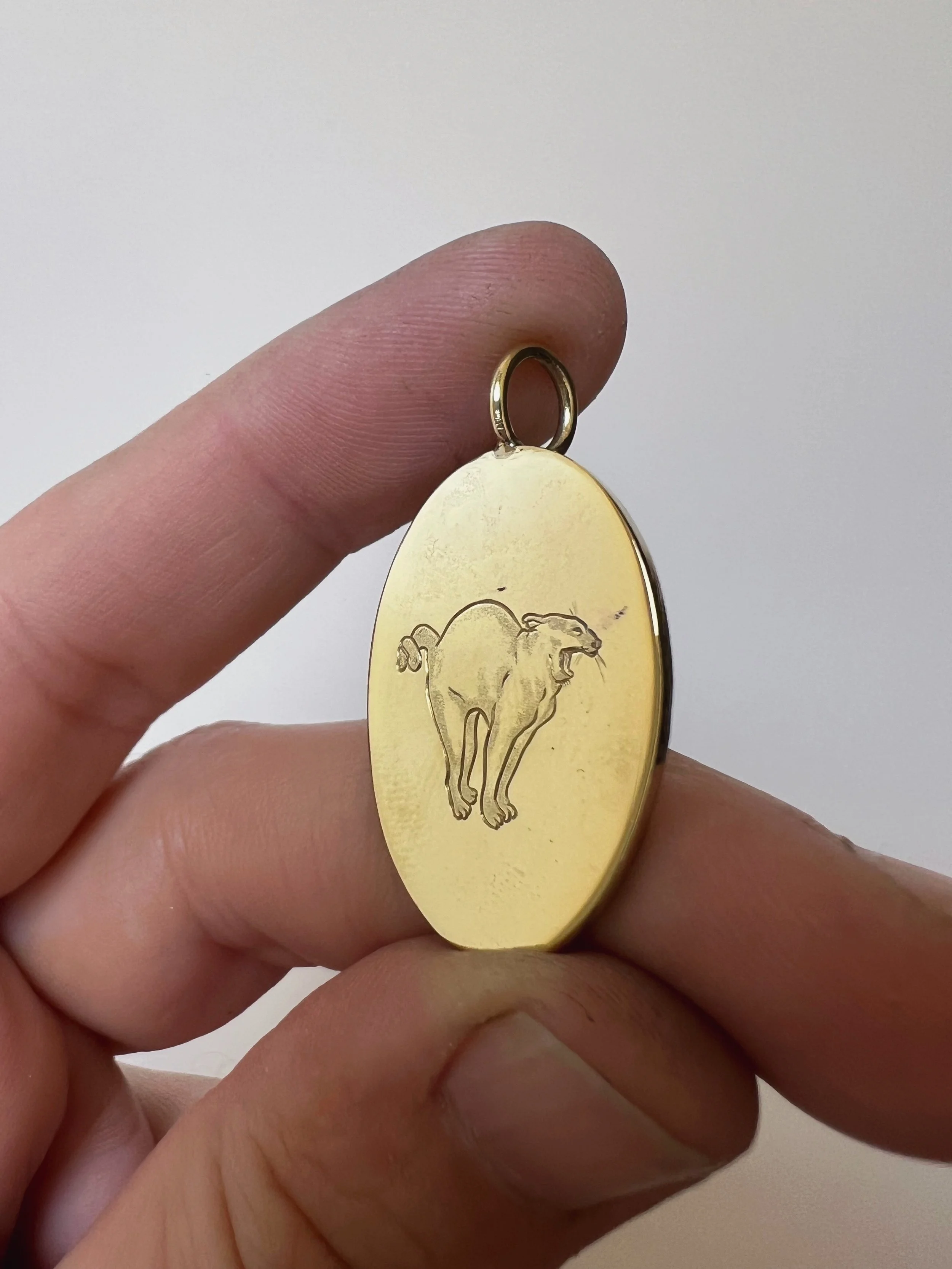 hand engraved cat pendant