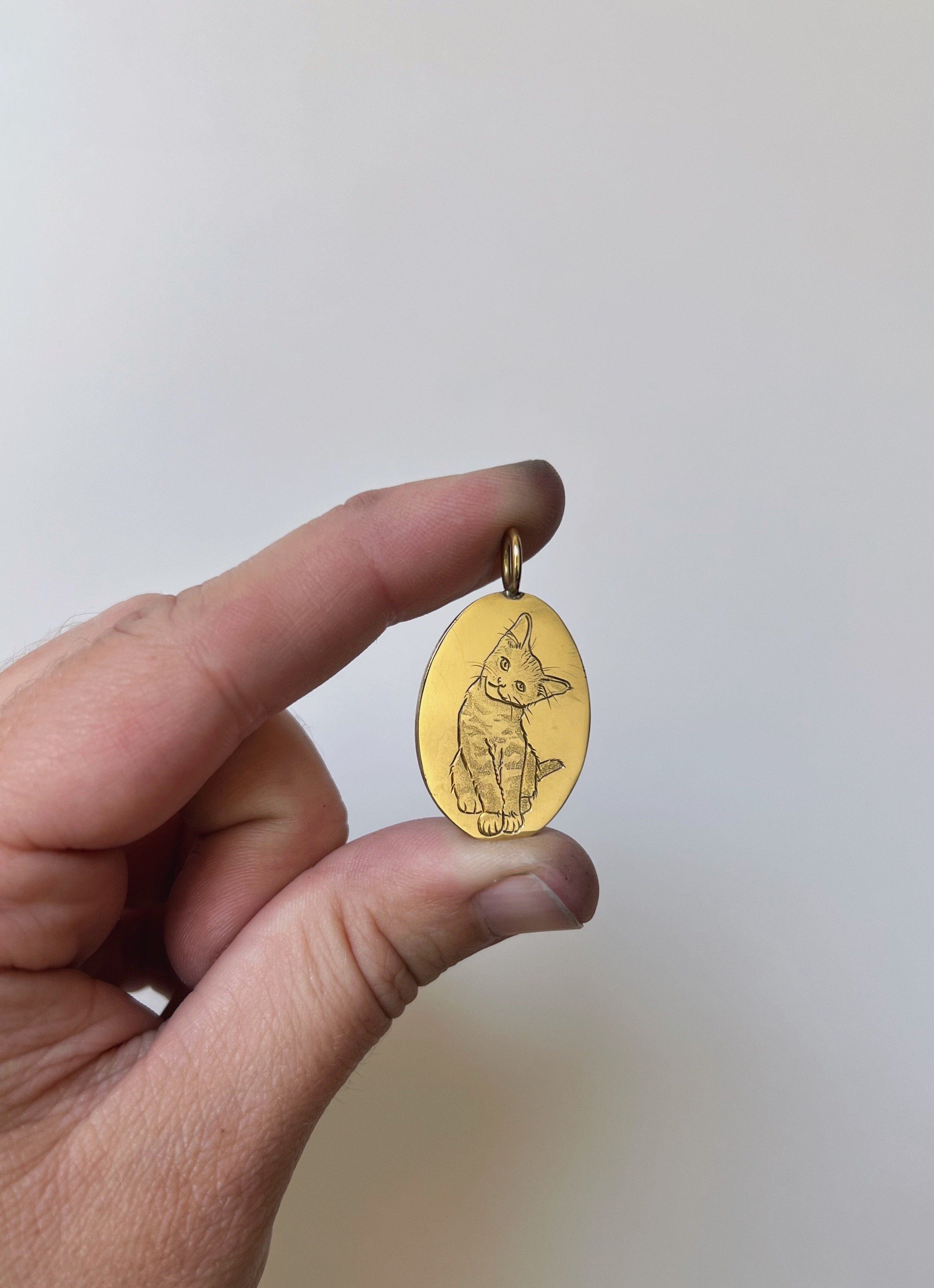 hand engraved cat pendant