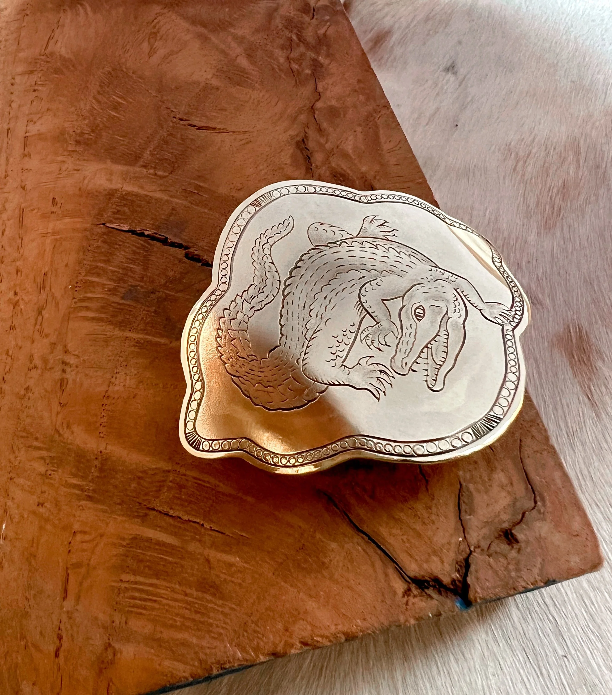 One-of-a-kind hand-engraved brass slide featuring an alligator