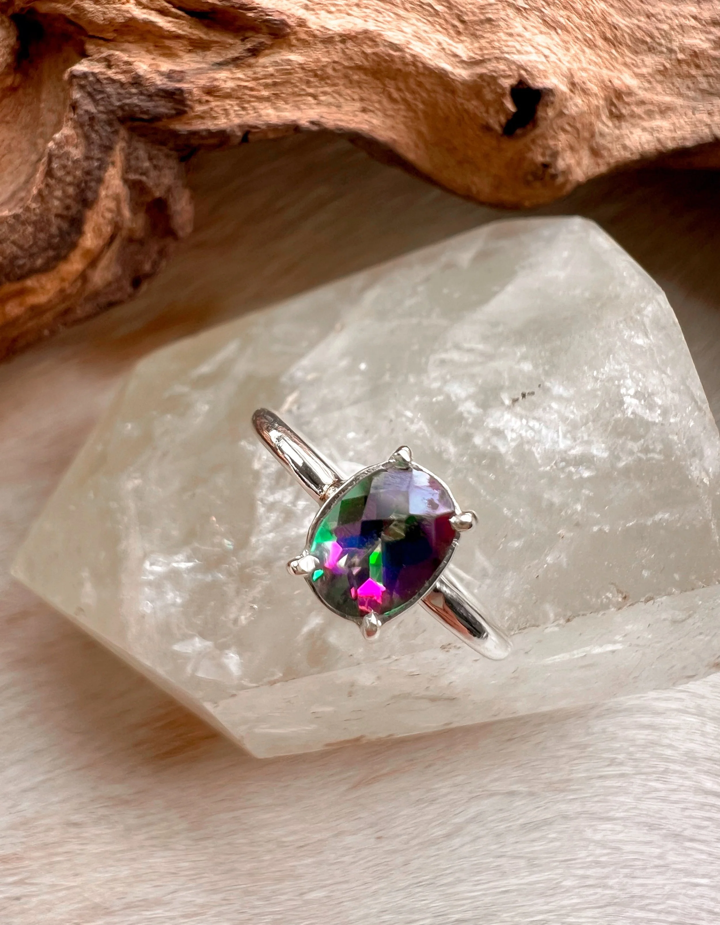 Rainbow Topaz set in a sterling silver claw setting