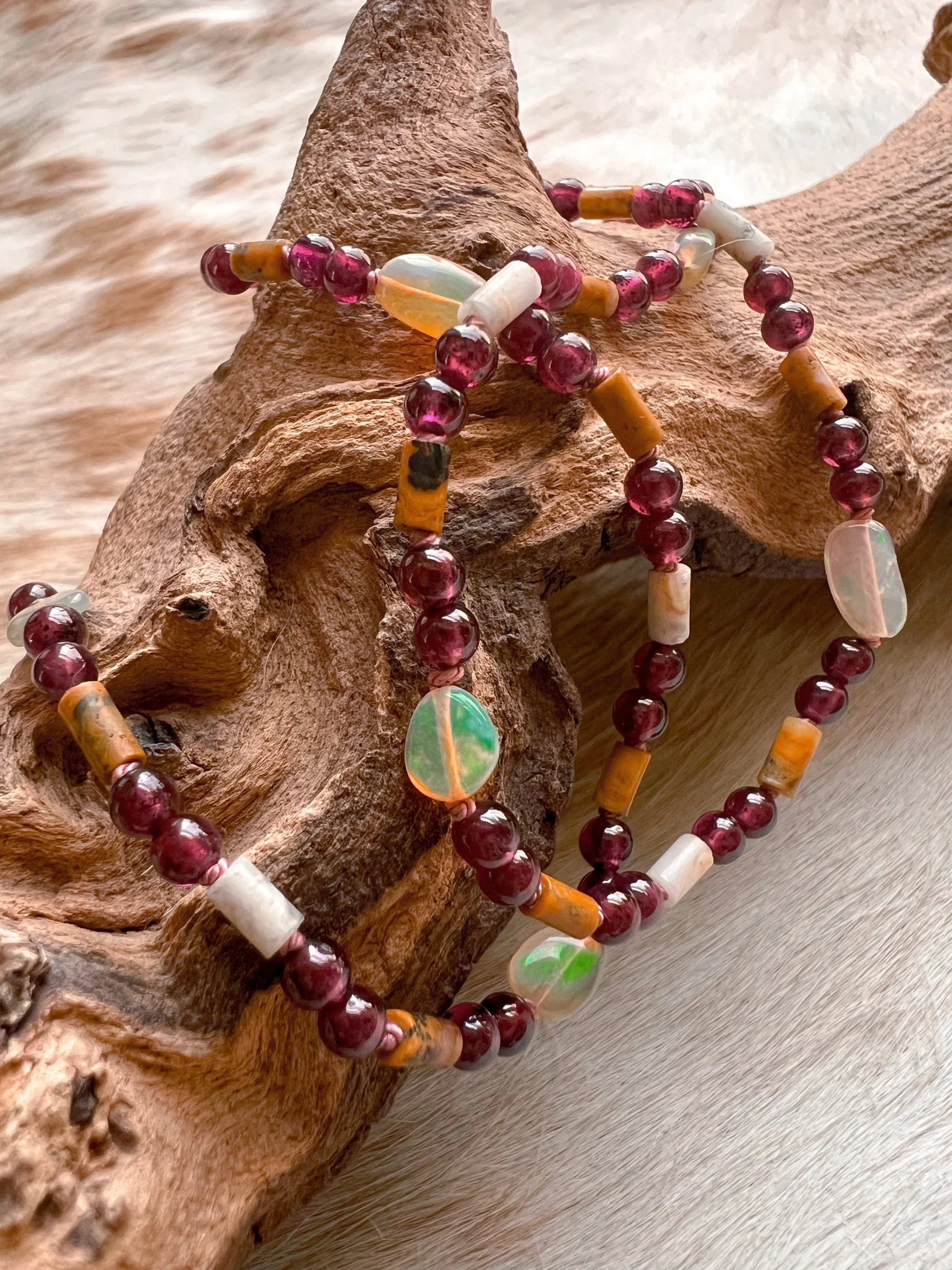 Hand-knotted necklace on pure silk featuring colorful gemstone beads