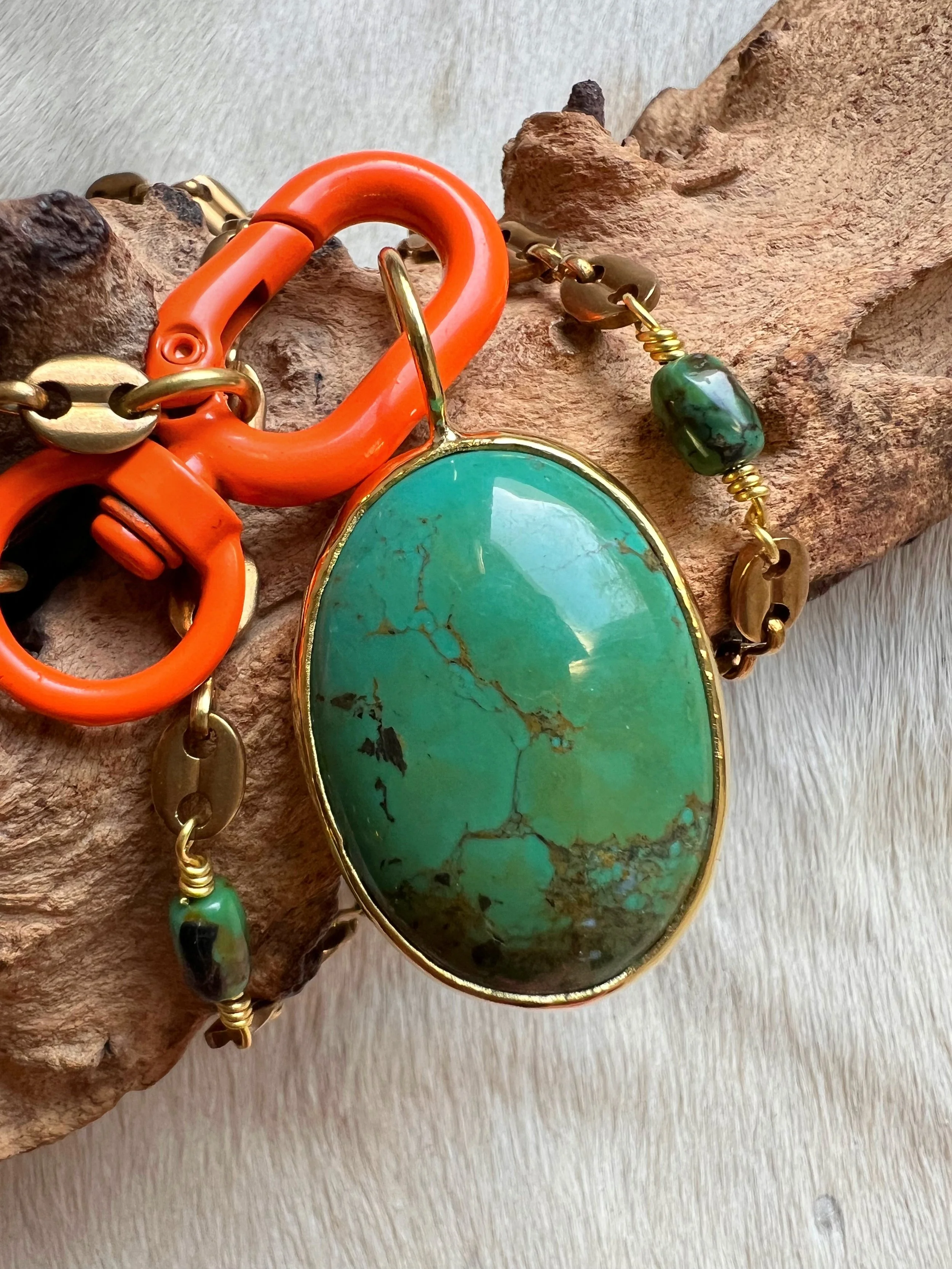 Large turquoise necklace on a bright orange toggle clasp
