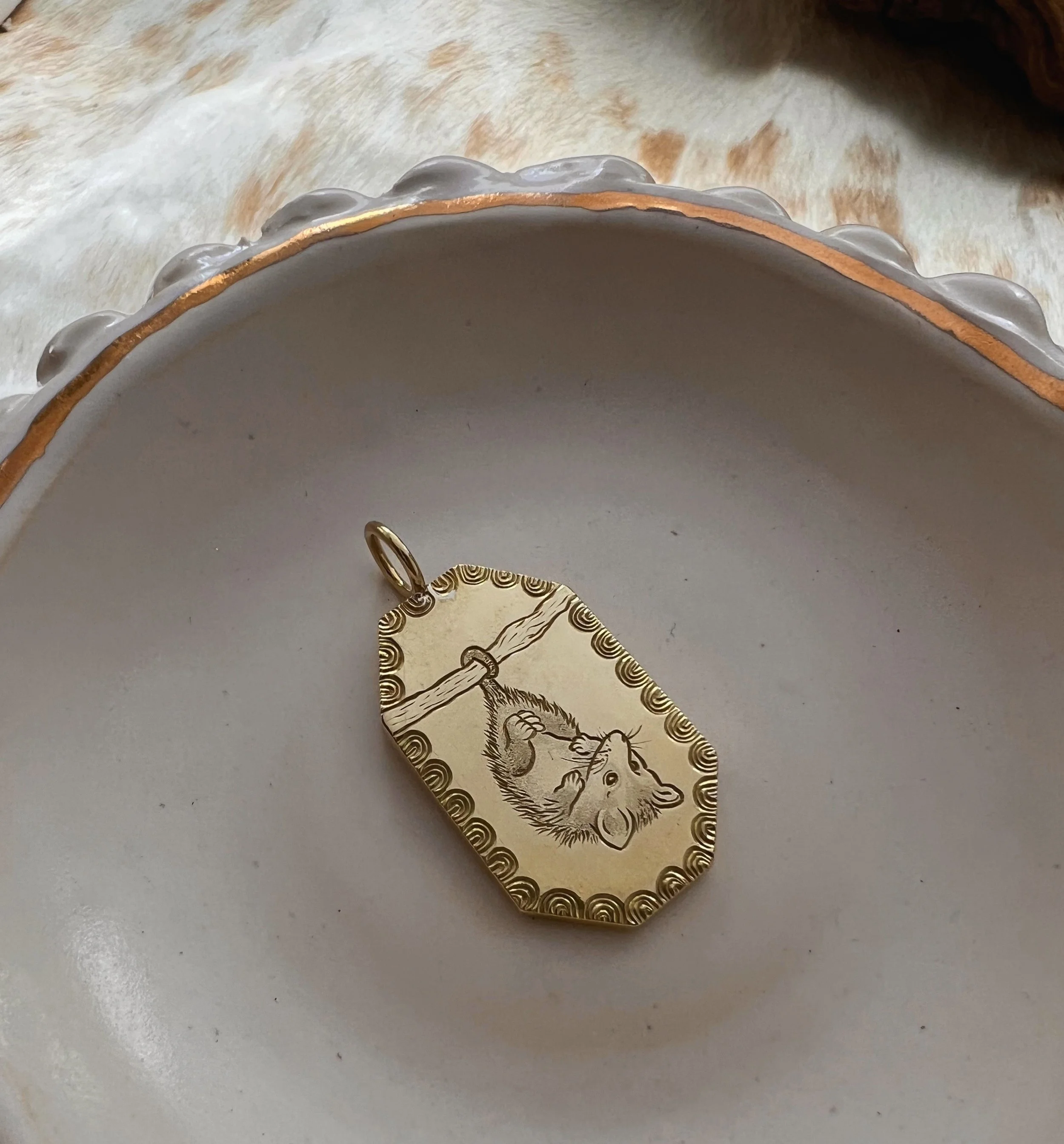 Hand engraved brass Opossum pendant