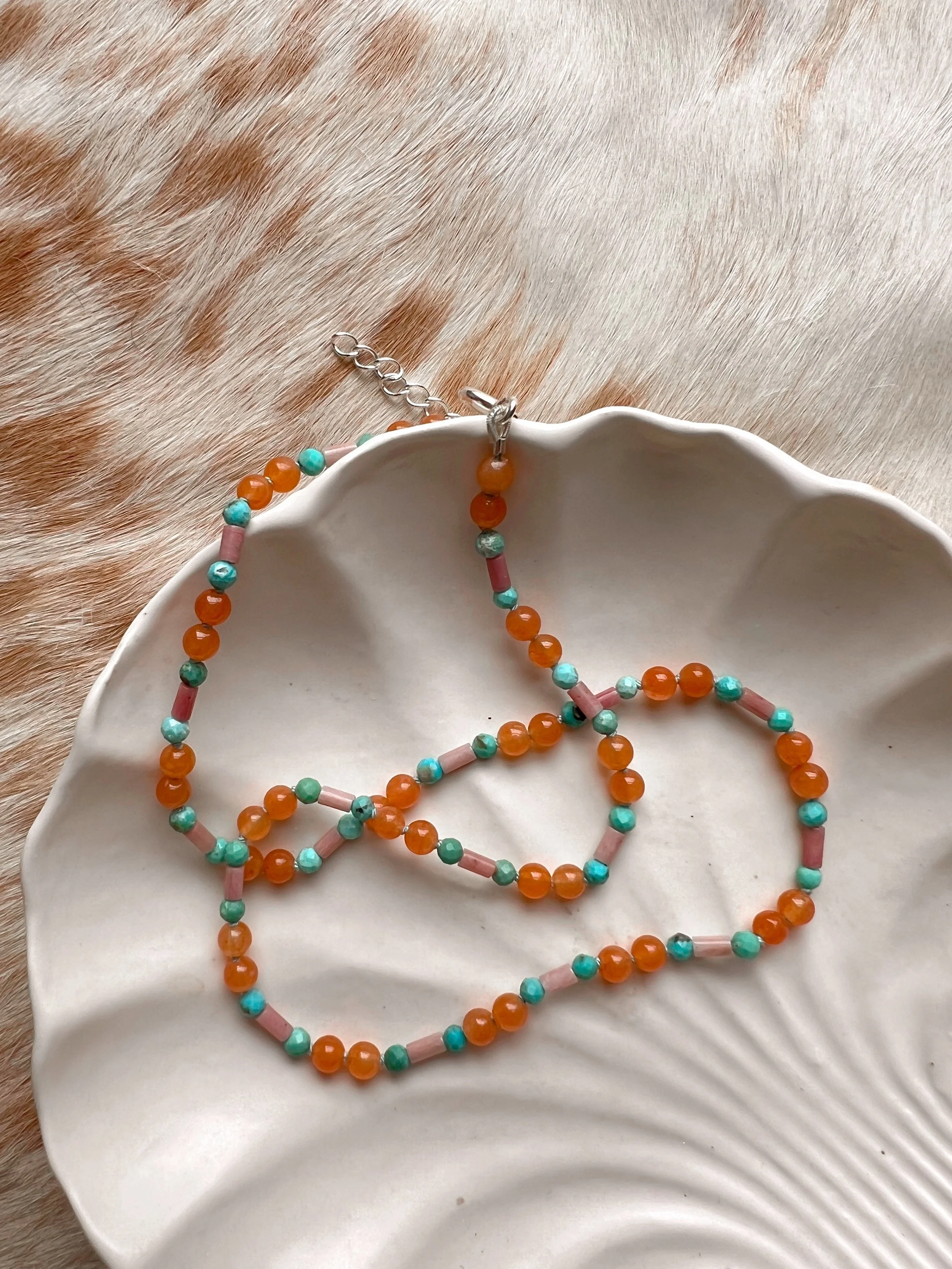 Hand-knotted necklace on pure silk featuring colorful gemstone beads