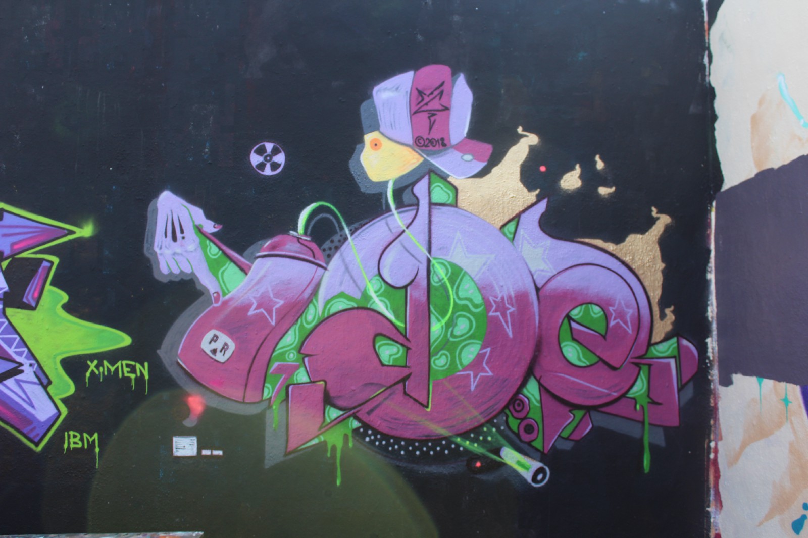 Sienide’s work behind Tuff City. Look closely at the slots within the outlet illustration, which are shaped like “PR” in homage to Sienide’s Puerto Rican roots.