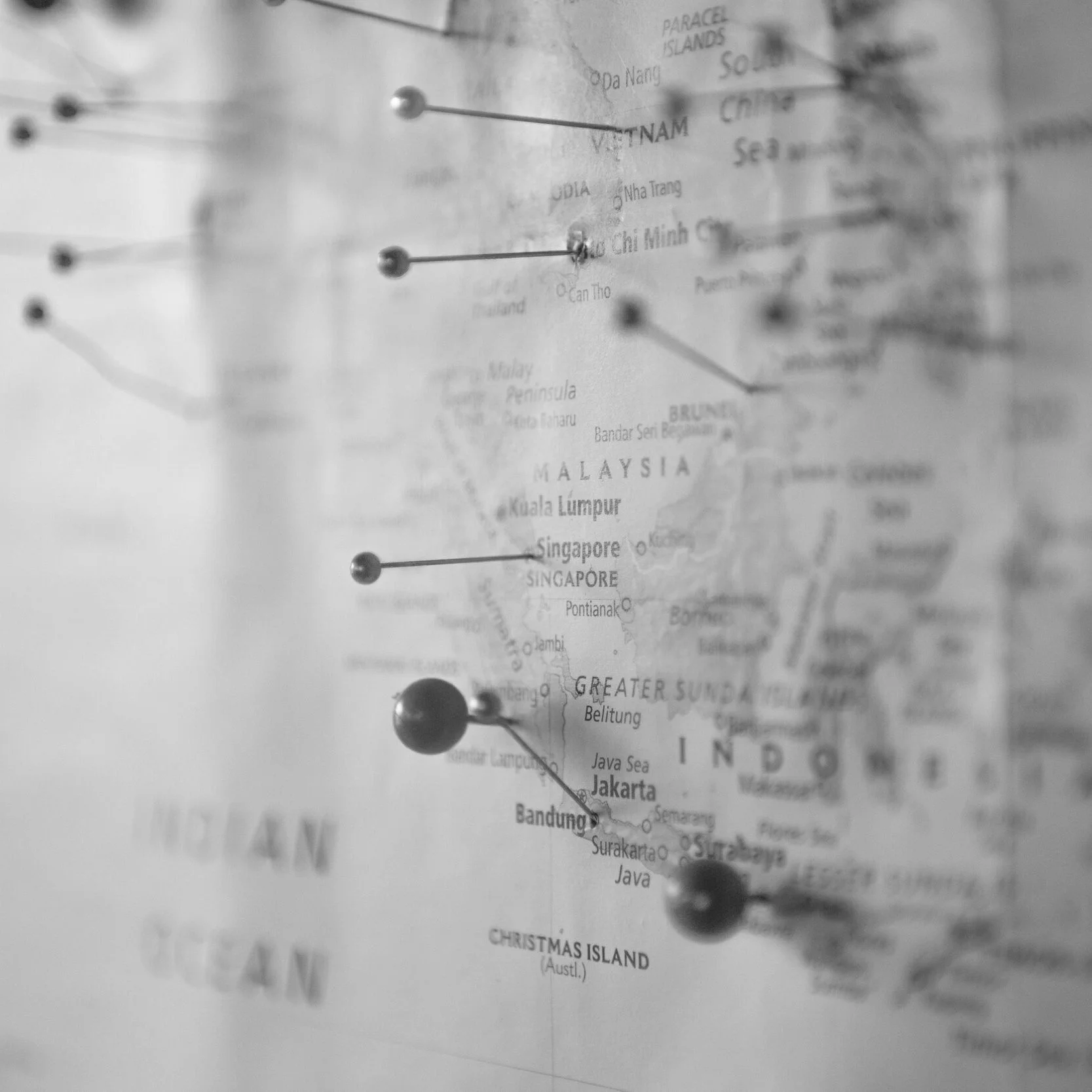 A black and white map of Southeast Asia with pins marking locations in Vietnam, Malaysia, Indonesia, and Singapore.