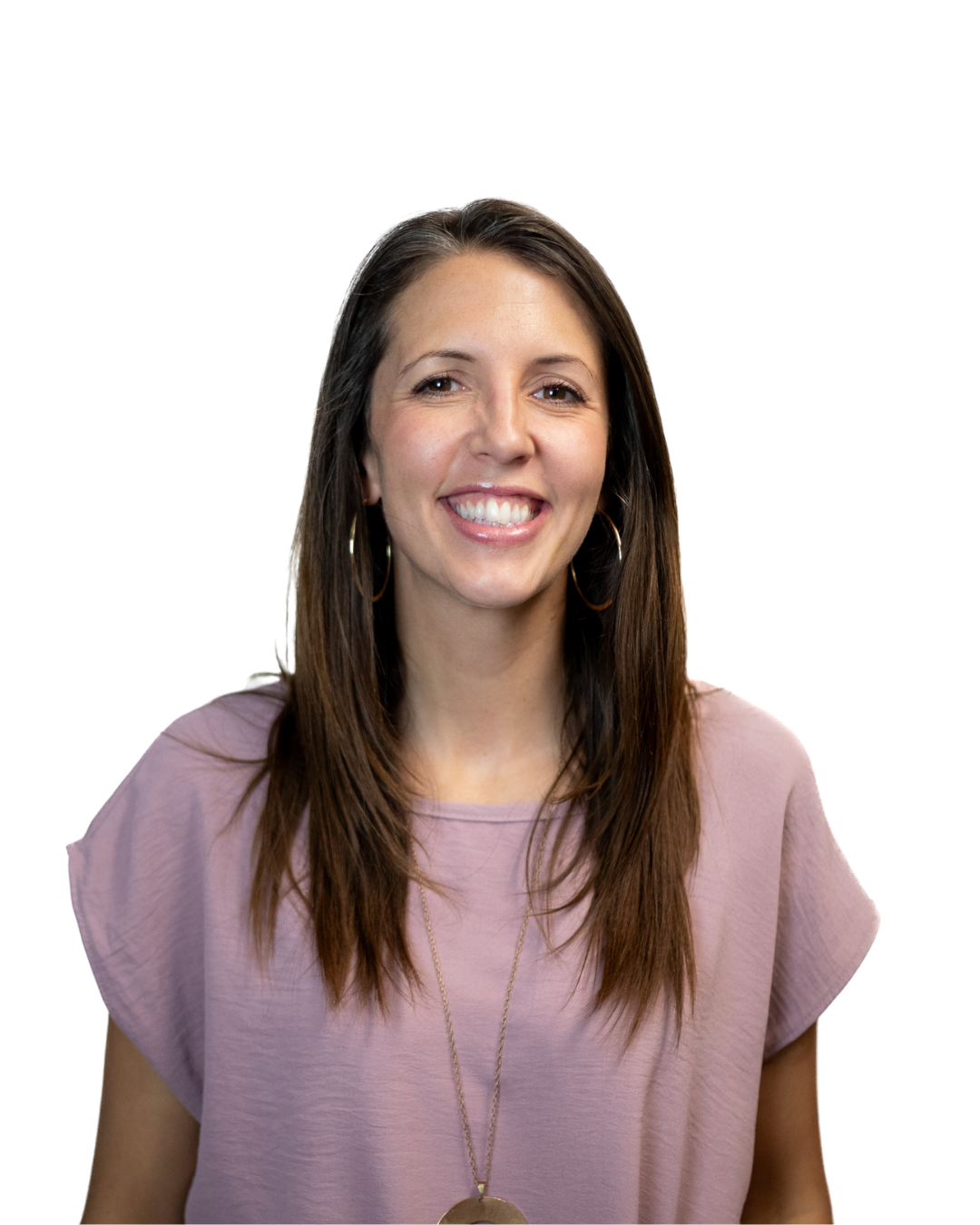 A young woman with long, curly brown hair, wearing glasses, hoop earrings, a necklace, and a brown sweater, smiling at the camera.
