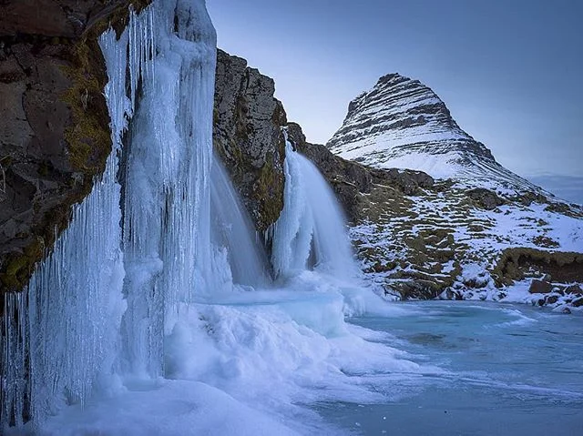 Kirkjufell mountain and Kirkjufellsfoss waterfall taken an hour after sunset in freezing conditions. #iceland #kirkjufell #kirkjufellsfoss #landscapephotography #freezing #waterfall #frozen #hasselblad #x1d50c #xcd45 #natgeoyourshot #travelphotograph