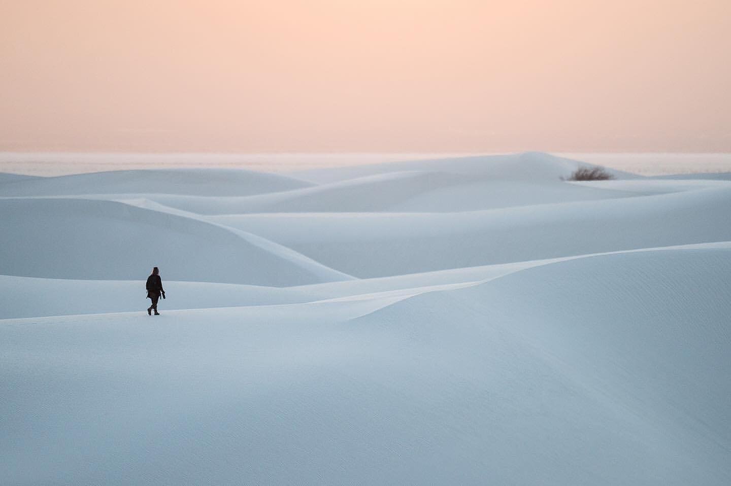 &ldquo;A lone photographer strolls into the frame during sunset at White Sands National Park. These expansive gypsum sand dunes are a telephoto lens paradise and I had a blast photographing small scenes such as this.&rdquo; #slowphotographymovement
&