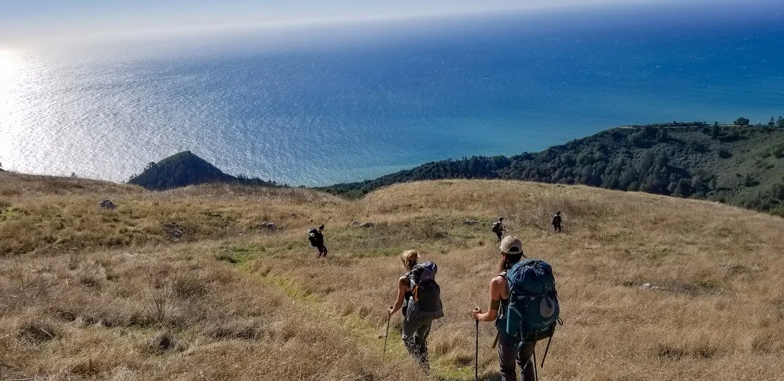 friends hiking to ocean.jpg