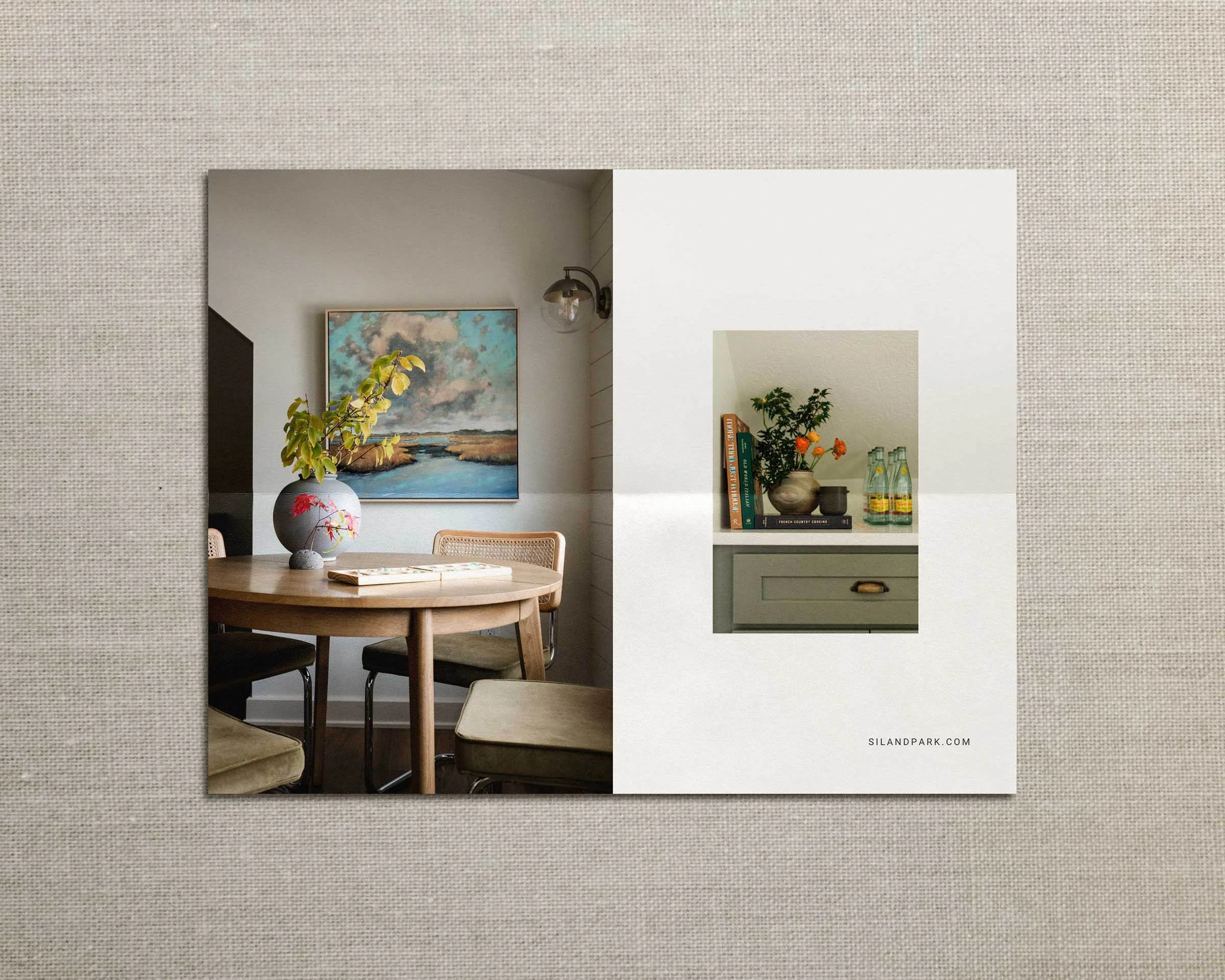 SIL & Park Interiors work, showing a dining room on the left with a wooden table, beige chairs, a large vase; and a close-up of a small nook on the right with a plant, a stack of books, decorative bottles, and a cabinet. Mockup by Clarke Creative.