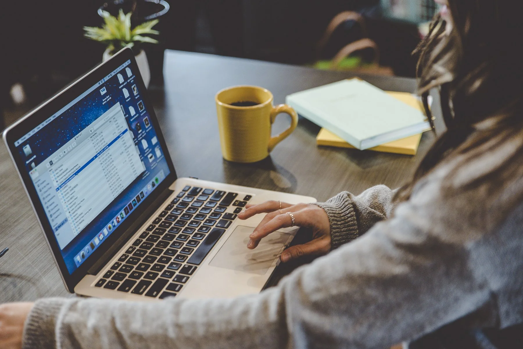 Rachelle Clarke looking at her computer at her brand strategy studio, Clarke Creative.