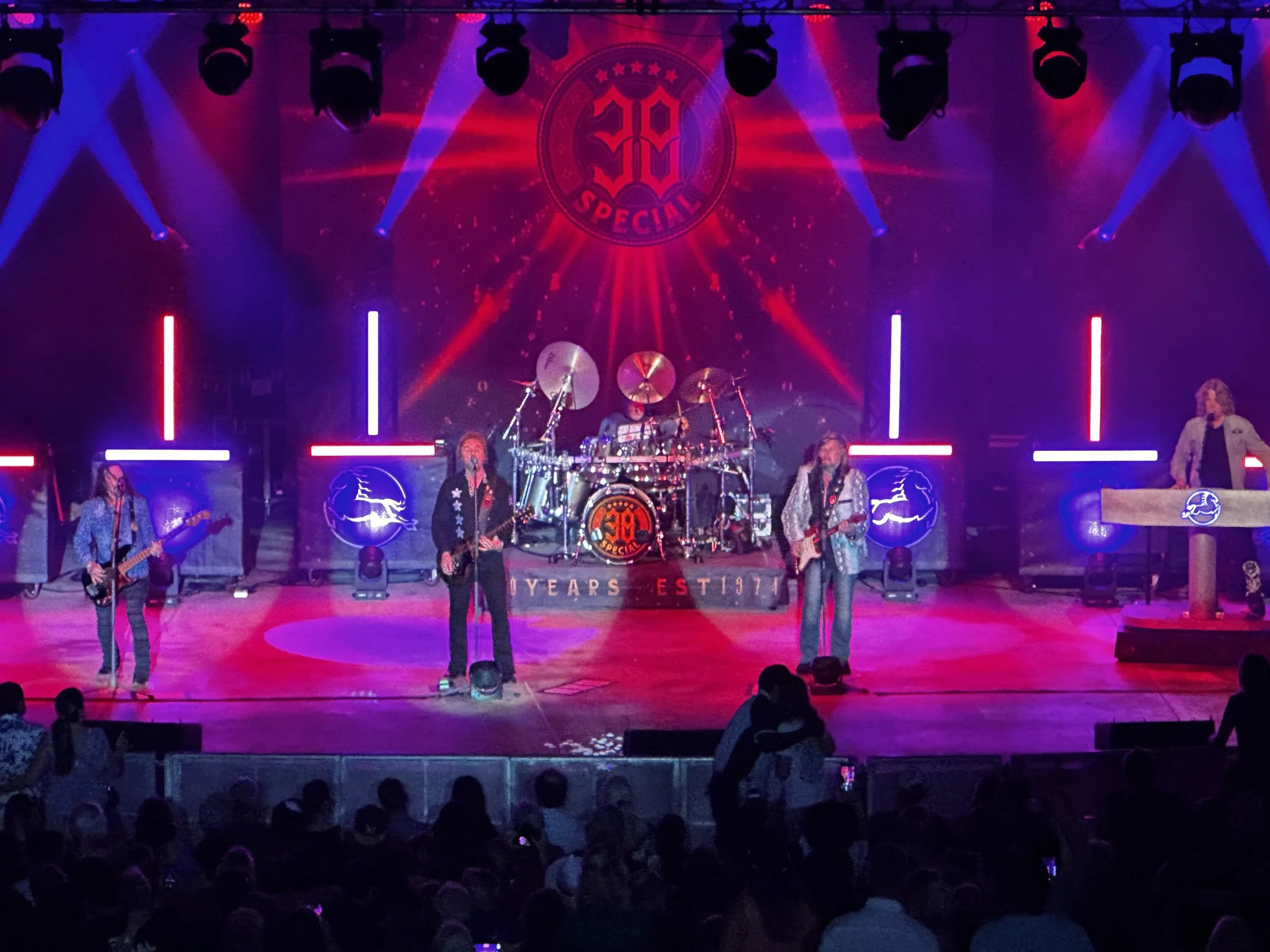 Professional concert lighting setup with moving heads and LED fixtures on stage in South Florida