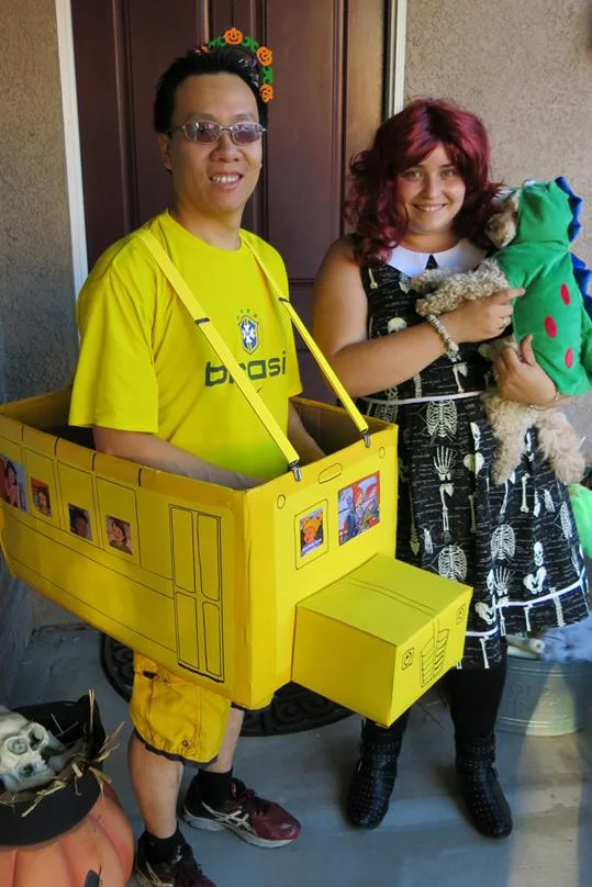 DJ playing Ms. Frizzle and the magic school bus (along with her husband Roee Fung and their dog Kai) to spark science joy
