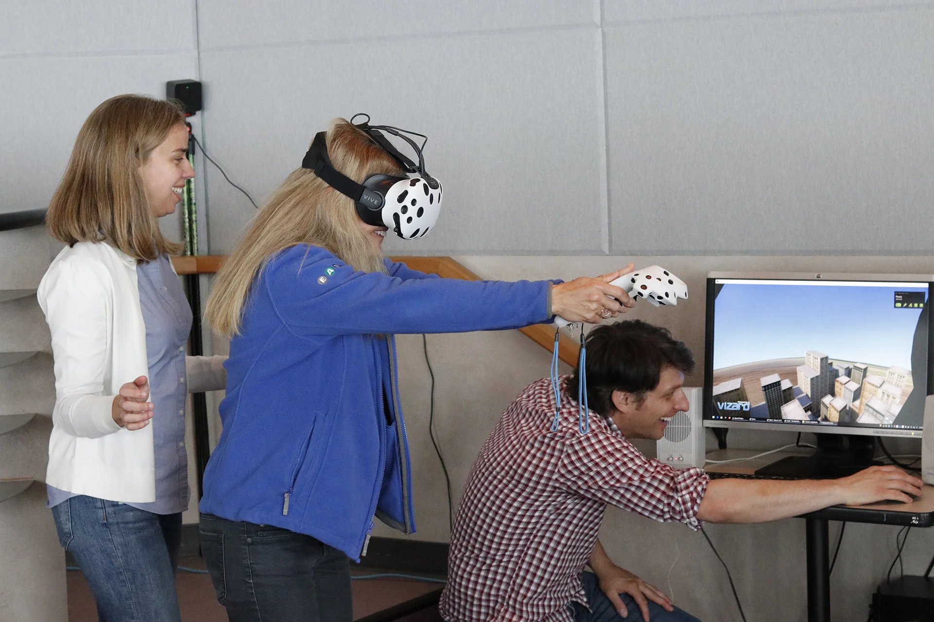 Géraldine Fauville guides Megan McCall through a Superhero VR simulation