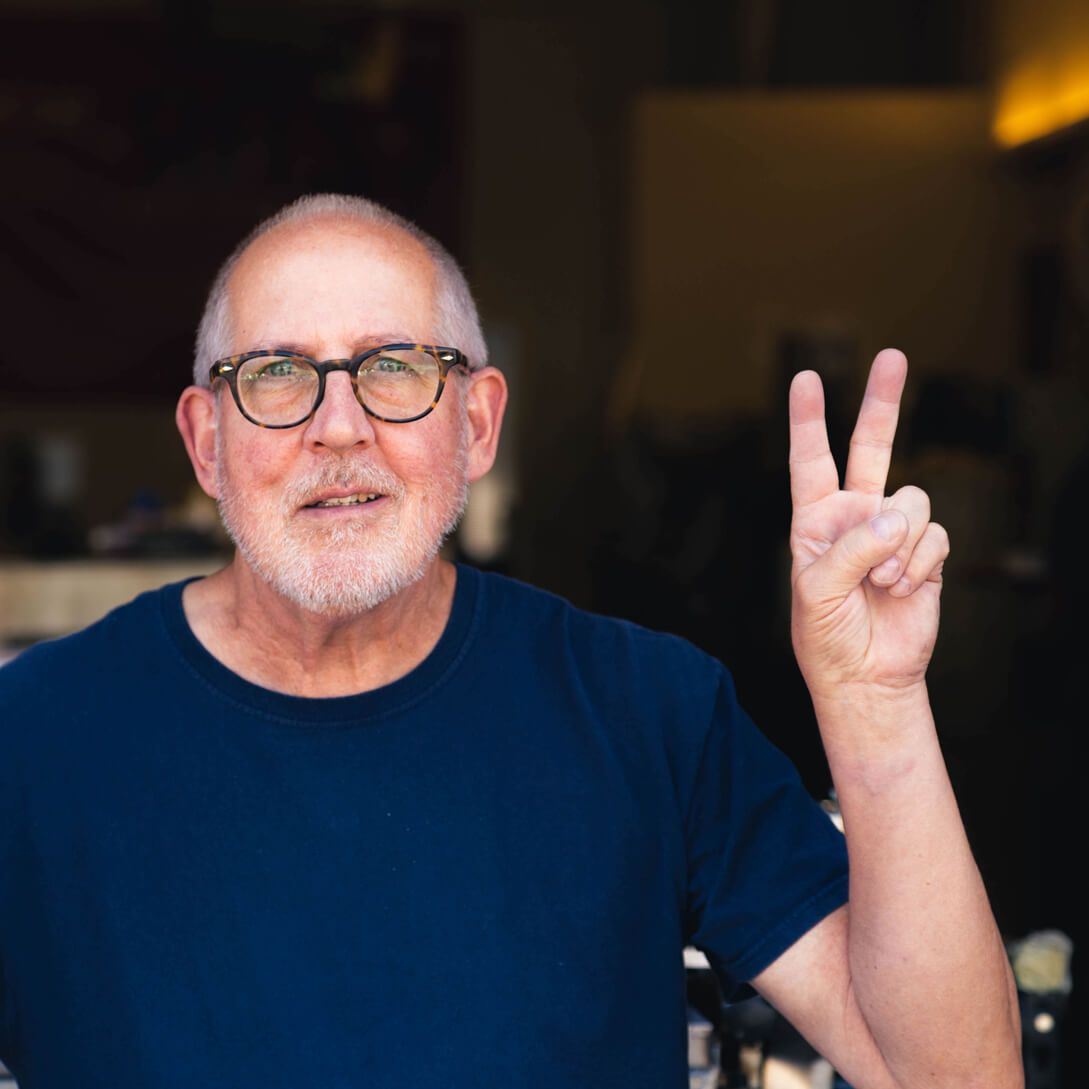 RON Ron is an Orange County native, but he is a man of many places and trades. Ron has a wealth of knowledge on just about everything. When he’s not letterpressing away with the fastest hands in the west, Ron enjoys the great outdoors and playing his Martin guitar. Pantone: No Pantones for Ron; he’s a blind letterpress sort of guy. Font: Hobeaux Paper: 220# FL White Lettra