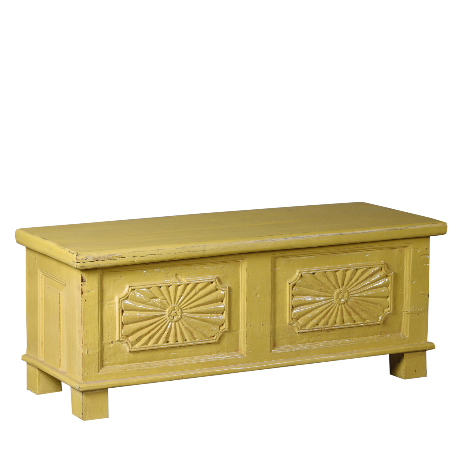 carved-yellow-coffee-table-trunk.png