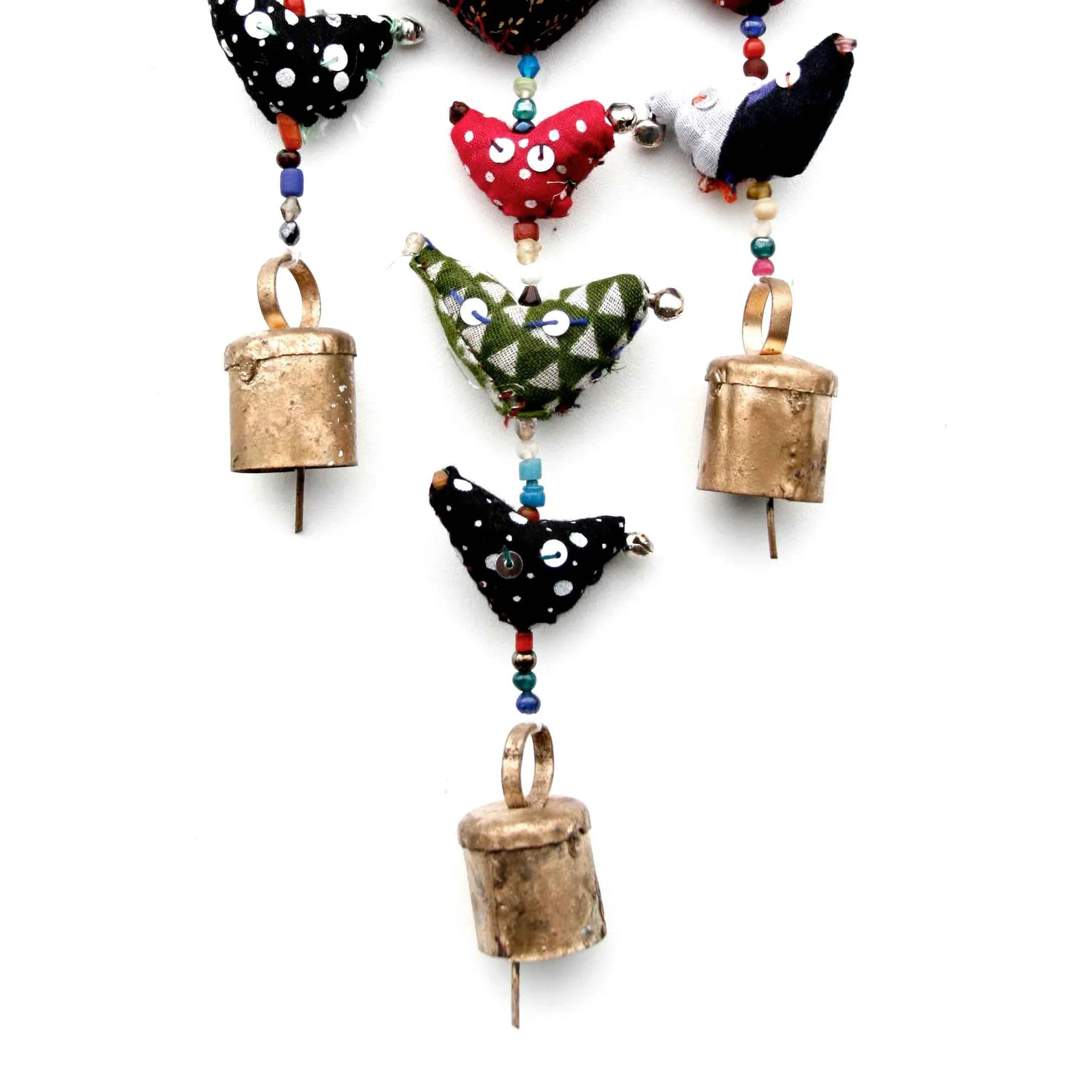 close‑up of fabric, beads, and bells on handmade prosperity hens